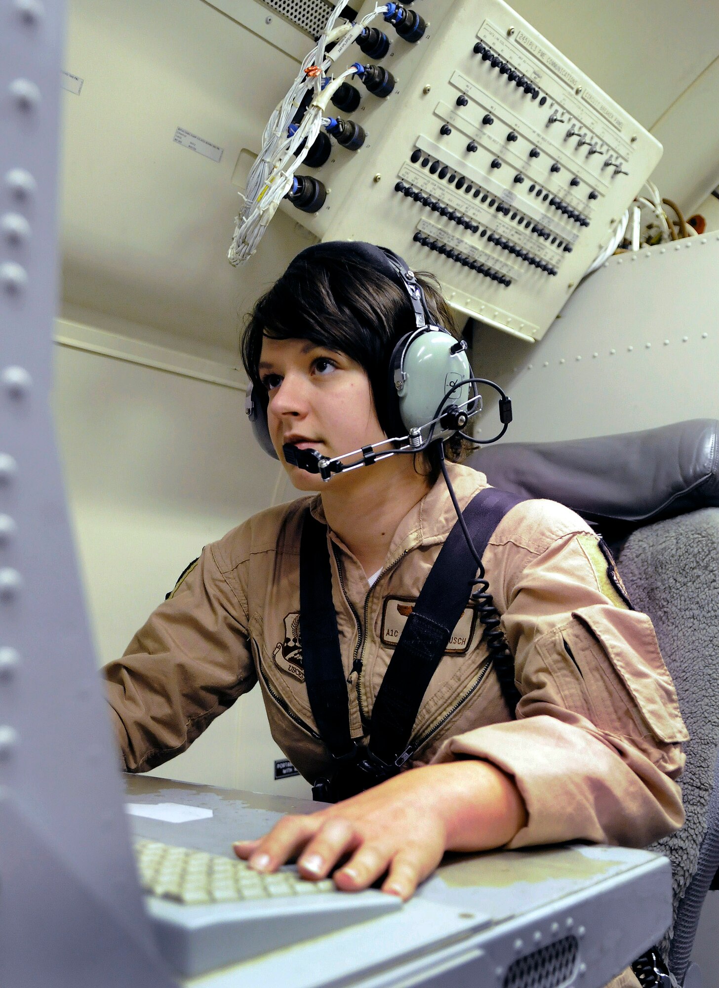 Airman 1st Class Sarah Mattausch troubleshoots radar issues Jan. 7 at an air base in Southwest Asia. Airman Mattausch is a an airborne radar technician assigned to the 7th Expeditionary Airborne Command and Control Squadron. She is a native of Valleyford, Wash., and is deployed from Robbins Air Force Base, Ga. (U.S. Air Force photo/Tech. Sgt. Michael Boquette) 
