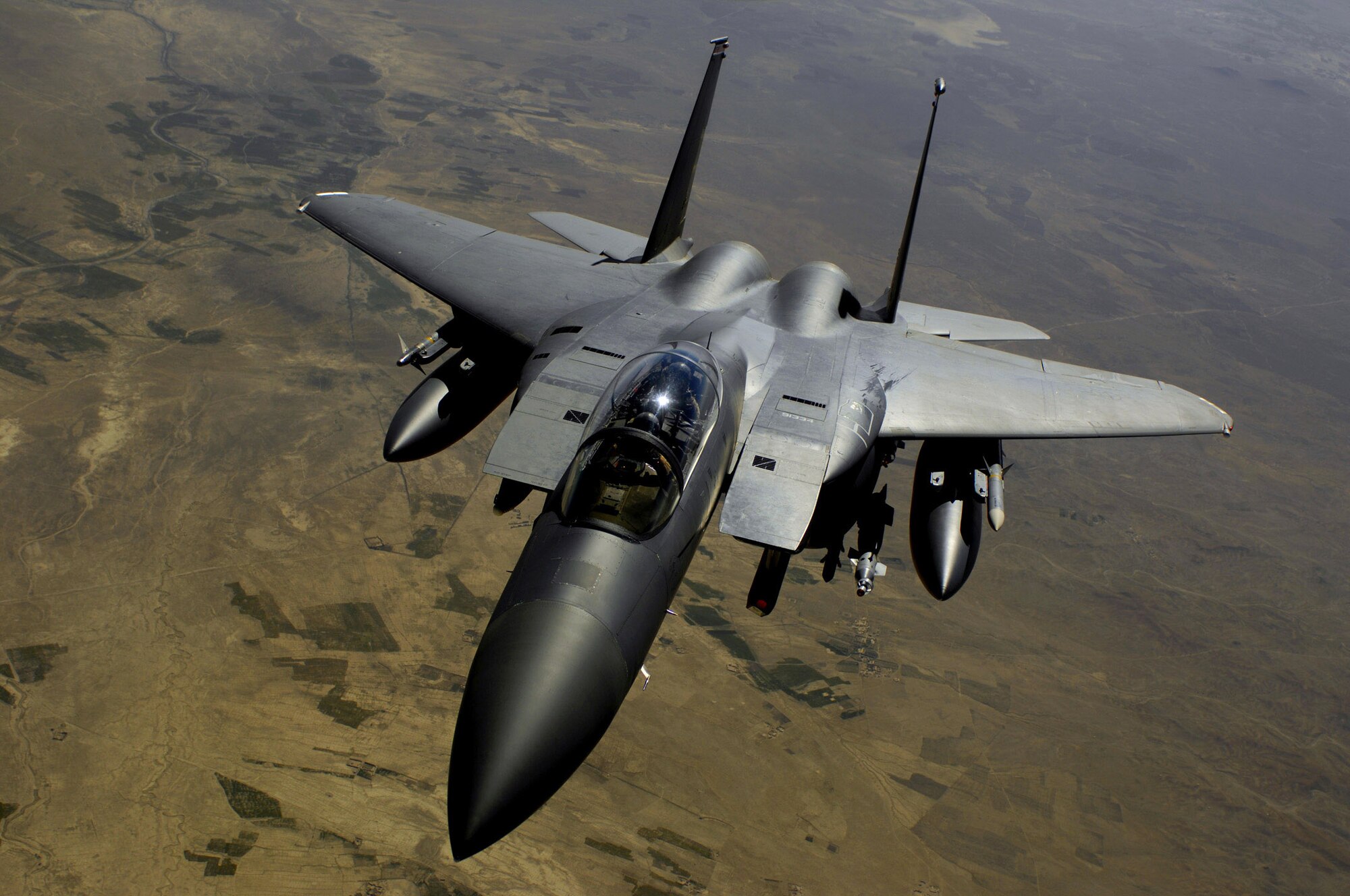 An F-15E Strike Eagle aircraft returns to the fight after receiving fuel from a KC-135R Stratotanker during a mission over Afghanistan.  The F-15E provides close-air support and armed aerial overwatch to deter enemy activities. (U.S. Air Force photo/Master Sgt. Andy Dunaway)