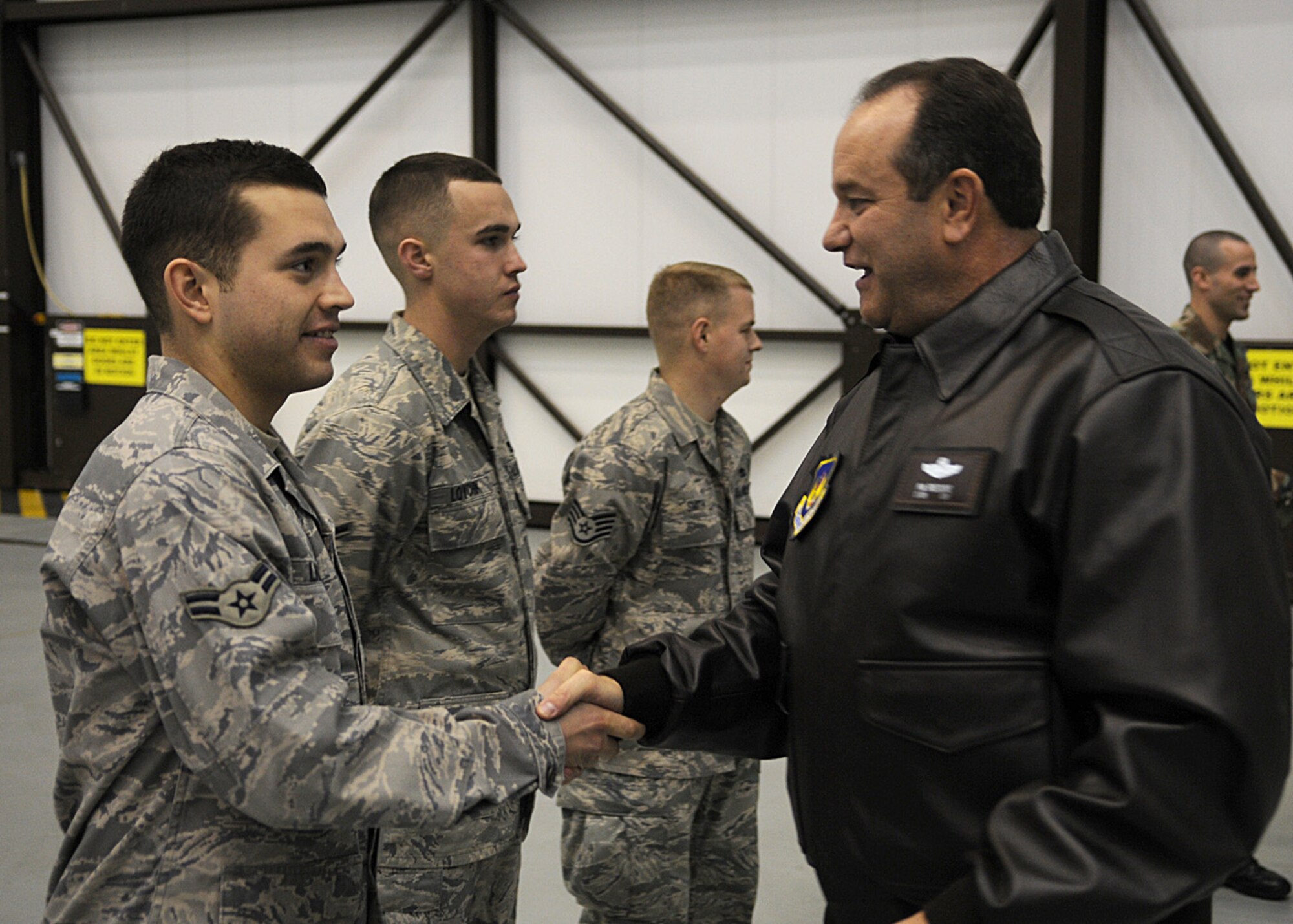 Lt. Gen. Philip M. Breedlove, 3rd Air Force commander, Ramstein Air Base, Germany, coins Airman 1st Class David Landrum from the 352nd Maintenance Squadron, Jan. 9, 2008, at RAF Mildenhall, England.  Airman Landrum was one of several Airmen General Breedlove coined for direct involvement towards the successful outcome of a rescue mission Dec. 10, 2008. The reason for Lt. Gen. Breedlove’s visit was to see the scope of RAF Mildenhall’s mission firsthand, while also meeting with Airmen across the base. (U.S. Air Force photo by Staff Sgt. Jerry Fleshman)