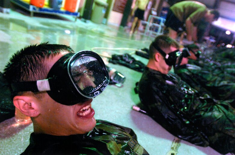 Pararescue candidate Airman Basic Matthew Bernard performs over 1,000 flutter kicks while wearing a water-filled mask after 20 hours of non-stop physical training. (U.S. Air Force photo)