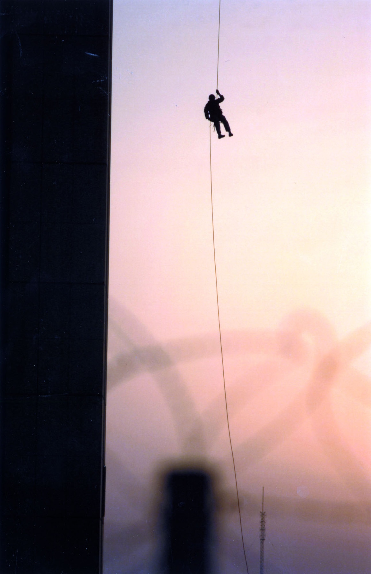 Pararescueman rappelling from the Baghdad International Airport control tower in July 2003. (U.S. Air Force photo)