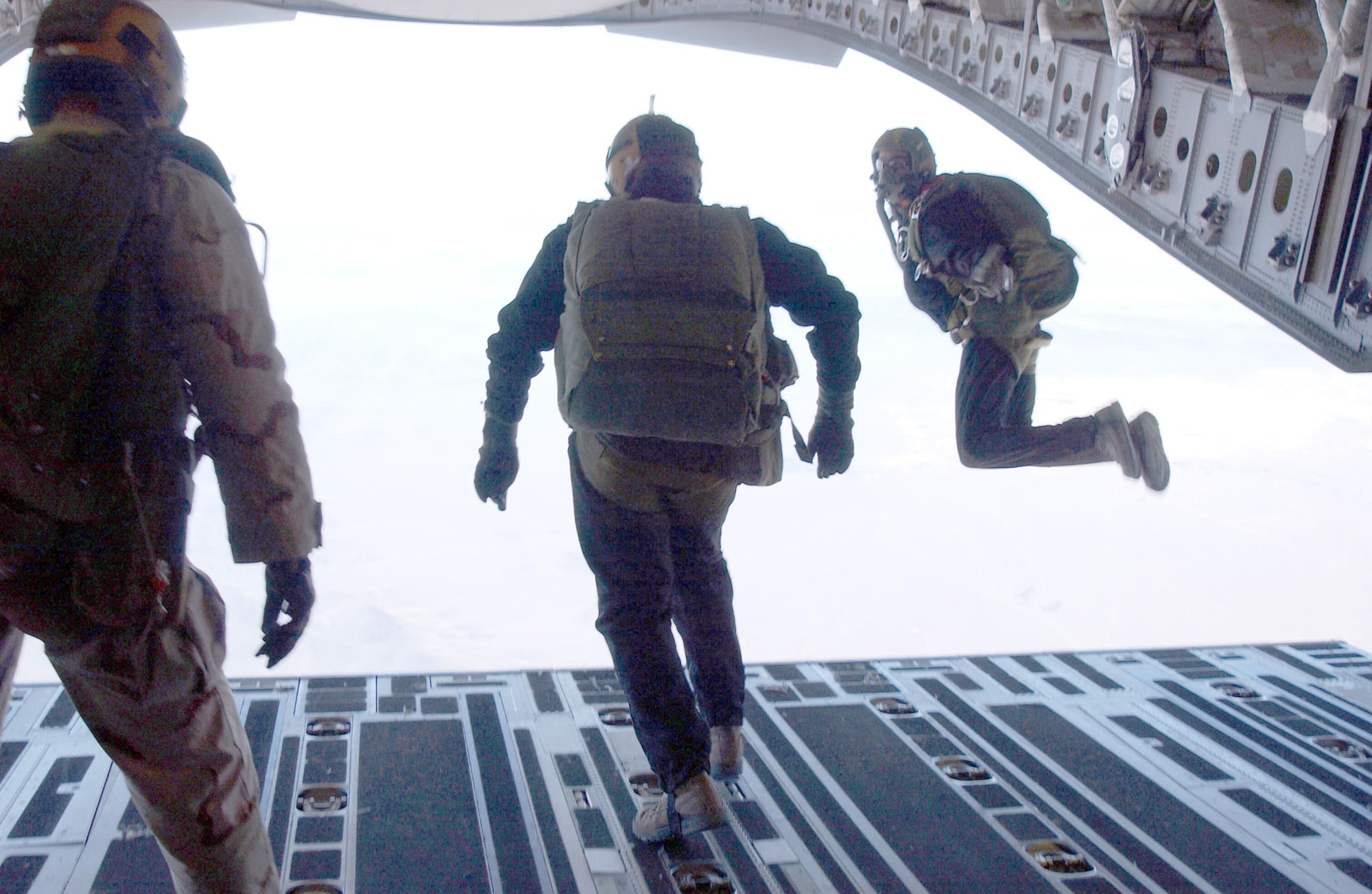 HALO (High Altitude, Low Opening) parachute training. Note the jumpers wear portable oxygen masks needed at high altitude. (U.S. Air Force photo)