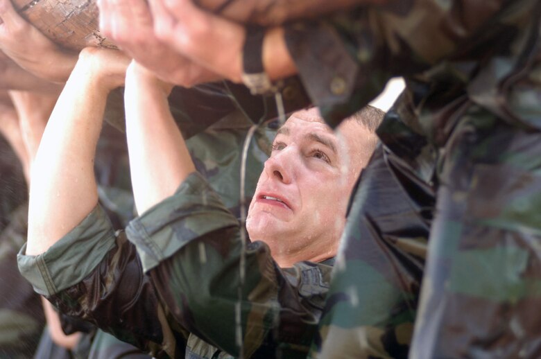 PJ candidate Airman 1st Class Michael Lauria shows the strain of rigorous training during pararescue indoctrination. (U.S. Air Force photo)