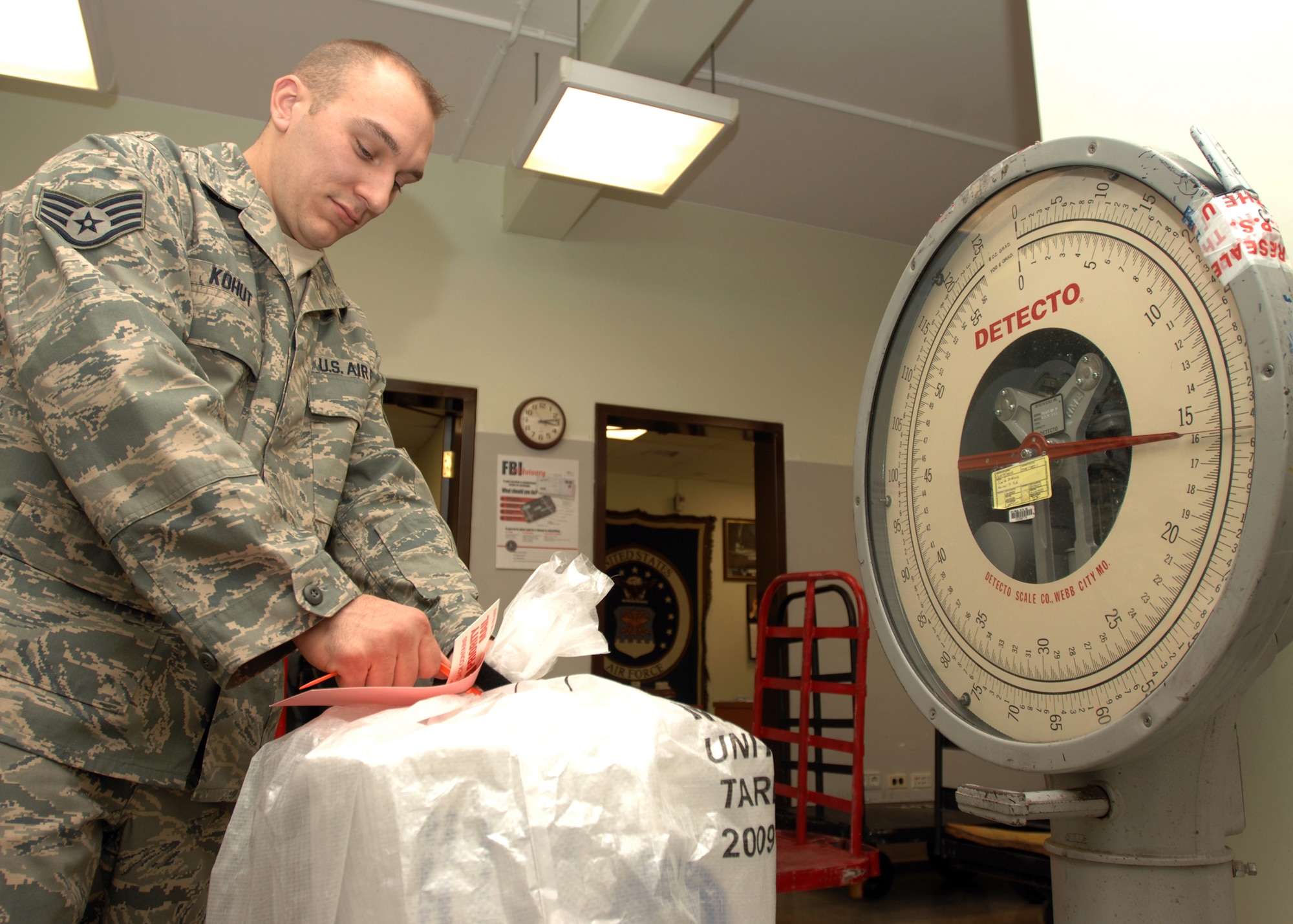 Staff Sgt. Mike Kohut, 39th Communications Squadron Official Document Center non-commissioned officer in-charge of registered mail, weighs a mail pouch for outgoing shipment Jan. 7 at the ODC. The ODC shipped 36,907 pounds of holiday mail in December alone. (U.S. Air Force photo by Staff Sgt. Jeff Nevison)