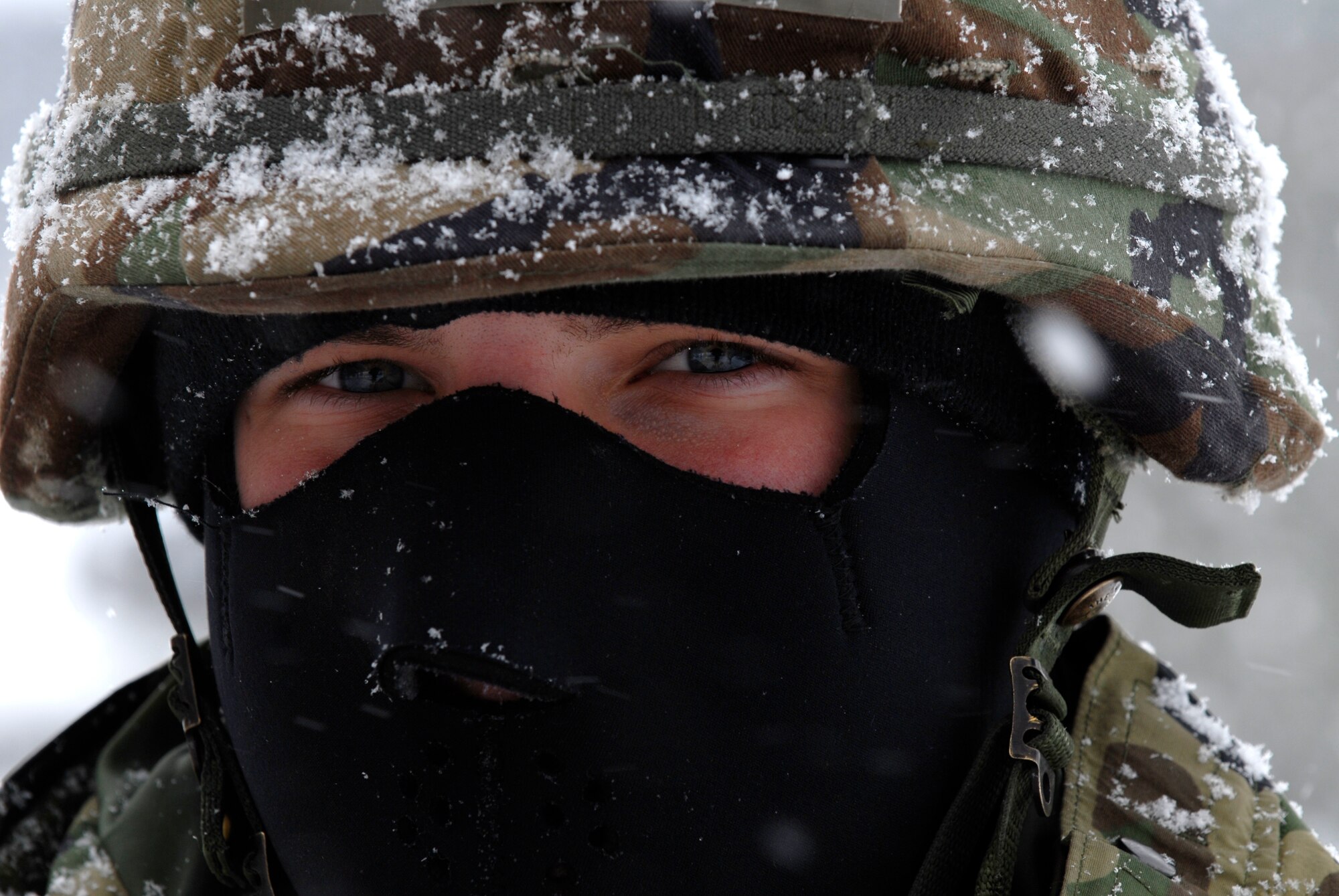 Senior Airman Nick Brewin, security forces augmentee, braves the cold while manning an entry control point during the Peninsula Wide Operation Readiness Exercise at Kunsan Air Base, Republic of Korea, Jan. 12, 2009. Kunsan received more than 10 inches of snow ahead of the week-long exercise. (U.S. Air Force Photo by SSgt Jason Colbert)