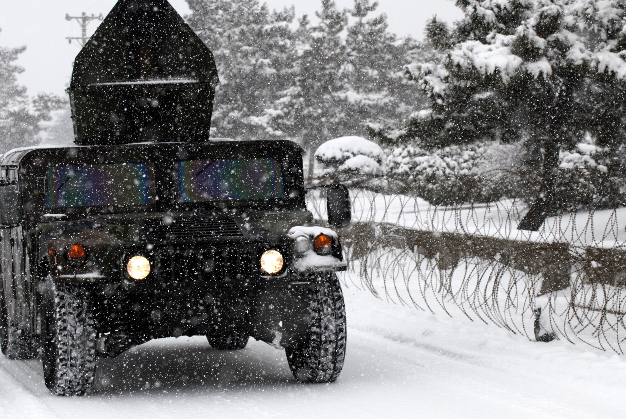 Airmen from the 8th Security Forces Squadron drive through a snow storm during the Peninsula Wide Operation Readiness Exercise at Kunsan Air Base, Republic of Korea, Jan. 12, 2009. Kunsan received more than 10 inches of snow ahead of the week-long exercise. (U.S. Air Force Photo by SSgt Jason Colbert)
