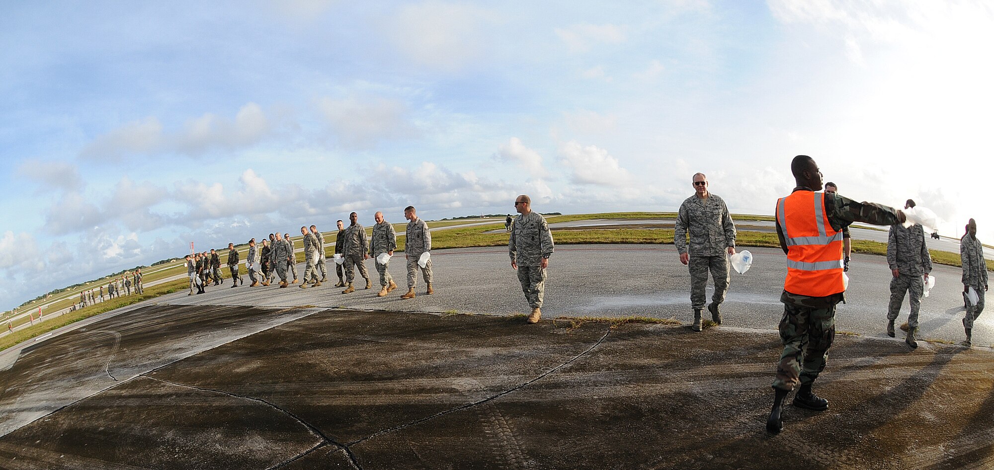 ANDERSEN AIR FORCE BASE, Guam - Two teams of approximately 350 people conduct a mass foreign object debris walk here Jan. 12. The purpose of the FOD walk is to assure a clean airfield for flightline operations and create a safe environment on the airfield for present and incoming aircraft. (U.S. Air Force photo by Senior Airman Nichelle Griffiths)   