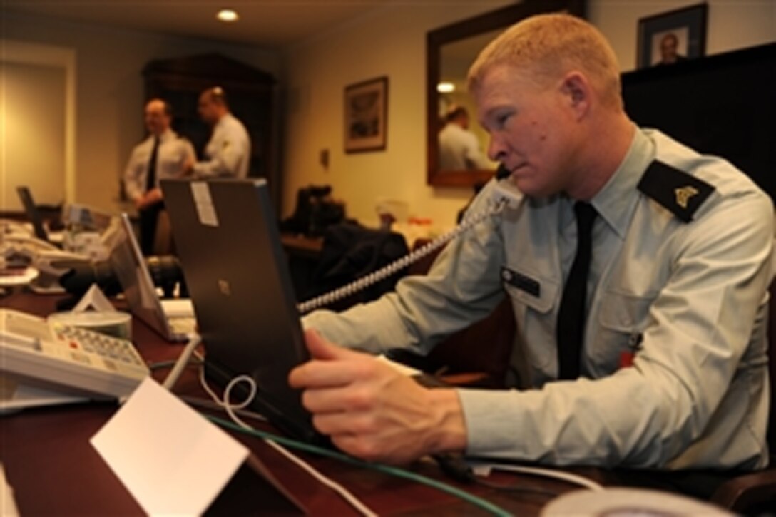 U.S. Army Sgt. Stephen Fouts, an Armed Forces Inaugural Committee member helps manage operations at the U.S. Capitol prior to the 56th Presidential Inauguration rehearsal in Washington, D.C., Jan. 11, 2009. The committee carries on a tradition, dating back more than 200 years, of honoring the new commander in chief by providing military ceremonial support to inaugurations. 
