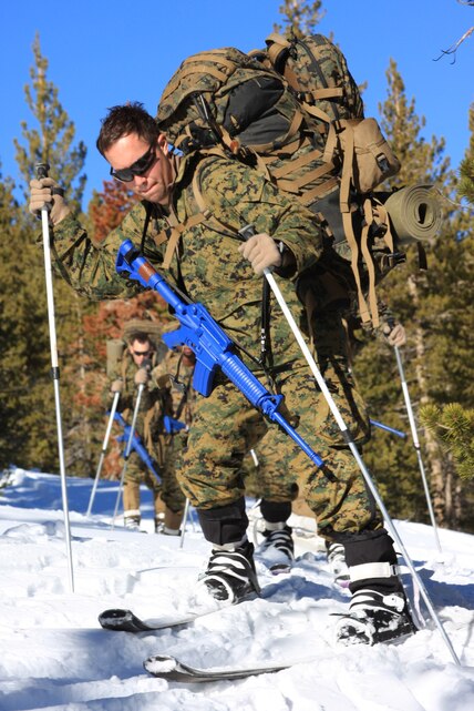 Petty Officer 3rd Class Salvador Bautista, a corpsman with Company I, 2nd Battalion, 4th Marine Regiment, maneuvers through the snow at Marine Corps Mountain Warfare Training Center Bridgeport, Calif., near the Goose training area to set up a warming station during a Cold Weather Medicine Course Jan. 14, 2009.
