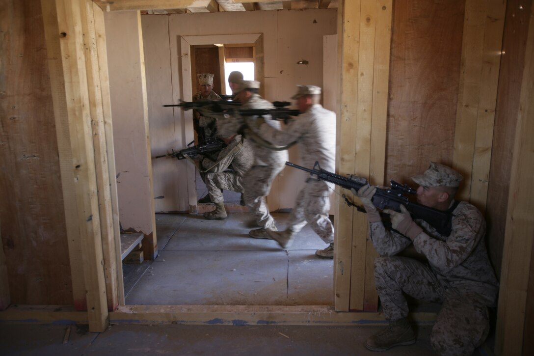 Marines from Echo Company, Battalion Landing Team 2/6, 26th Marine Expeditionary Unit, conduct house clearing drills, Jan. 13, 2009. The Marines were conducting the bilateral training to share their knowledge and to enhance combined and joint military relations. The 26th MEU is currently conducting sustainment training at Camp Buehring, Kuwait as part of its 2008-2009 deployment.