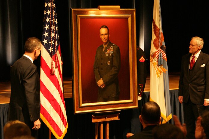 Gen. Peter Pace, 16th Chairman of the Joint Chiefs of Staff, and Peter Egeli watch as Pace's official portrait is unveiled during a ceremony in the Pentagon Auditorium Jan. 13. Egeli, a Drayden, Md., native who has devoted more than 50 years of his career as a Marine artist, painted the portrait.