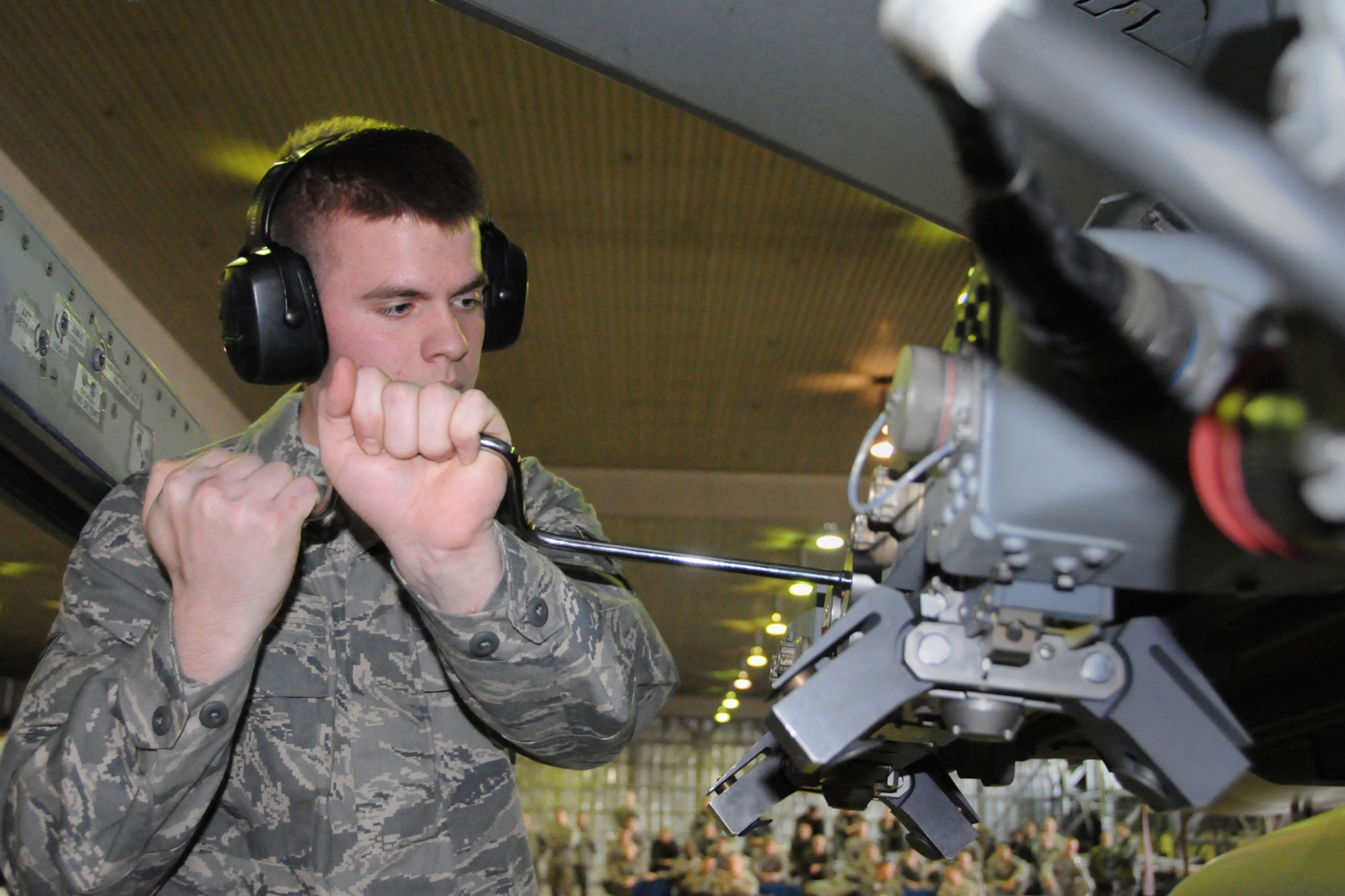 MISAWA AIR BASE, Japan -- Airman 1st Class Andrew Capps, weapons-load crew member, 35th Aircraft Maintenance Squadron, prepares an F-16 during a weapons-load competition Jan. 9, 2009. Airman Capps served as the 2-man and got the aircraft ready before munitions were loaded. (U.S. Air Force photo by Senior Airman Jamal D. Sutter)