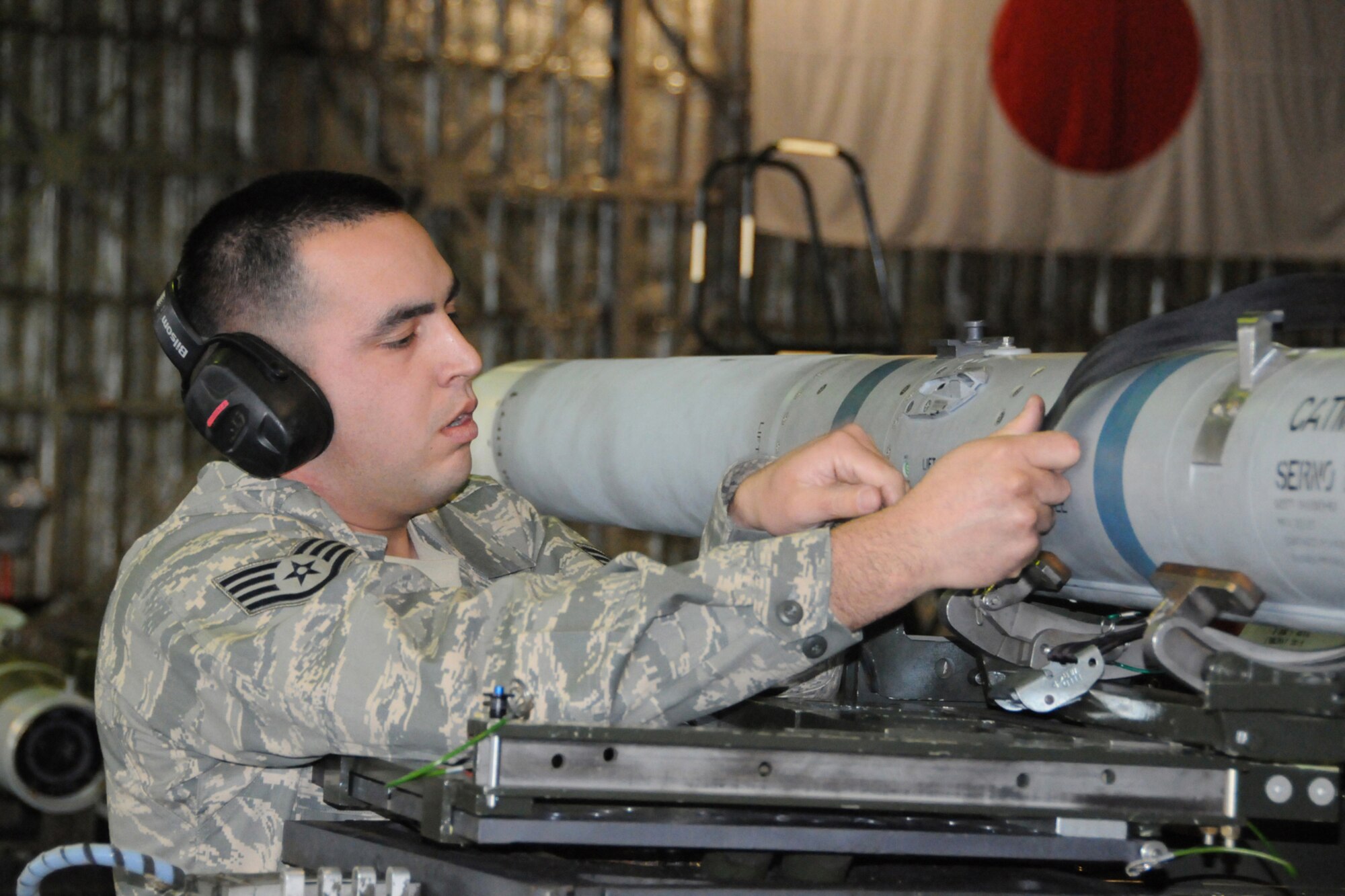 MISAWA AIR BASE, Japan -- Staff Sgt. Jack Holmes, weapons-load crew chief, 35th Aircraft Maintenance Squadron, prepares for a munitions load during a load-crew competition Jan. 9, 2009. Sergeant Holmes and his team's time will be judged against a load crew deployed in Iraq. (U.S. Air Force photo by Senior Airman Jamal D. Sutter)