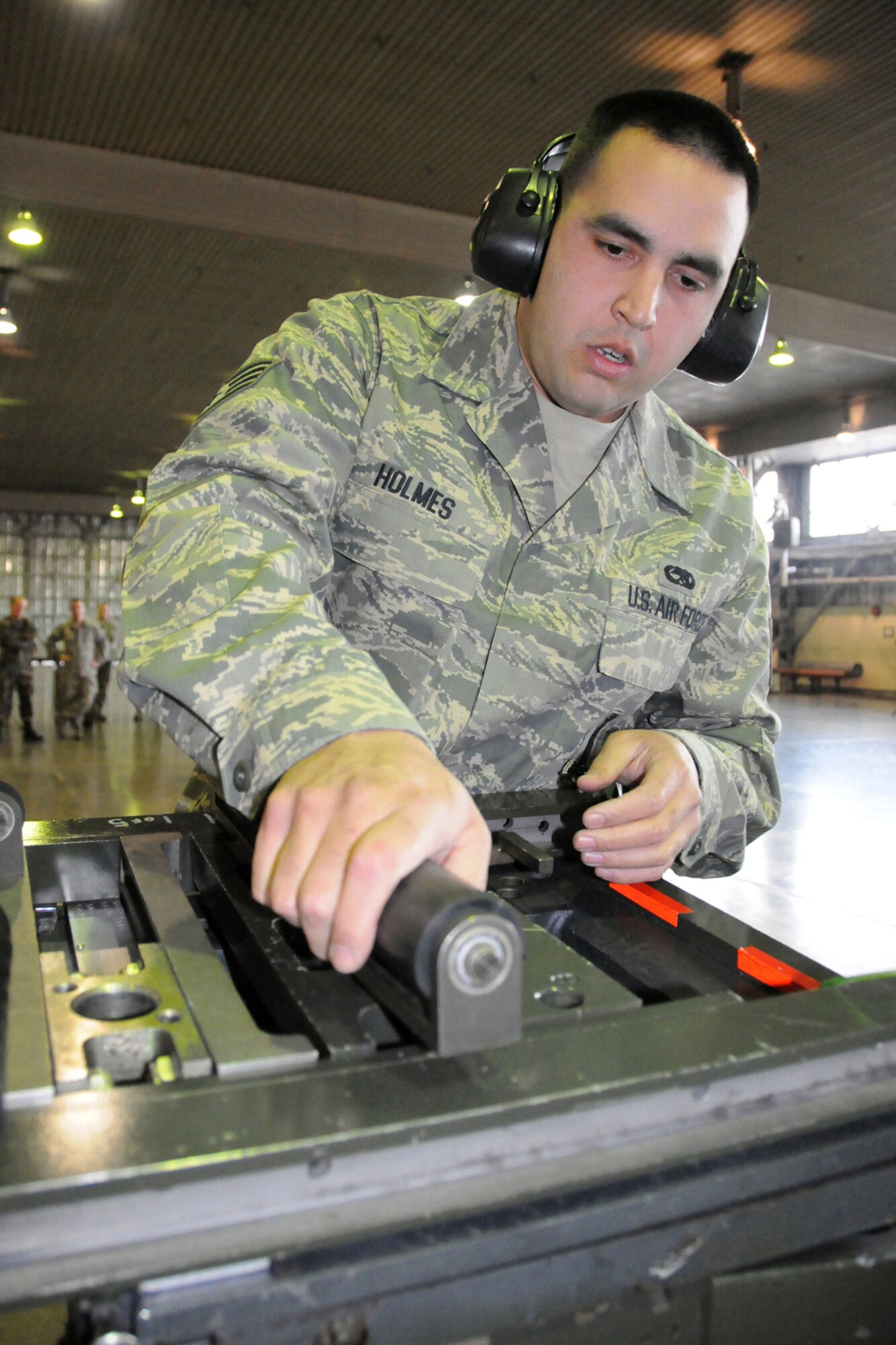 MISAWA AIR BASE, Japan -- Staff Sgt. Jack Holmes, weapons-load crew chief, 35th Aircraft Maintenance Squadron, prepares for a munitions load during a load-crew competition Jan. 9, 2009. Sergeant Holmes' primary job during the operation was to run the checklist and ensure the load went smoothly. (U.S. Air Force photo by Senior Airman Jamal D. Sutter)