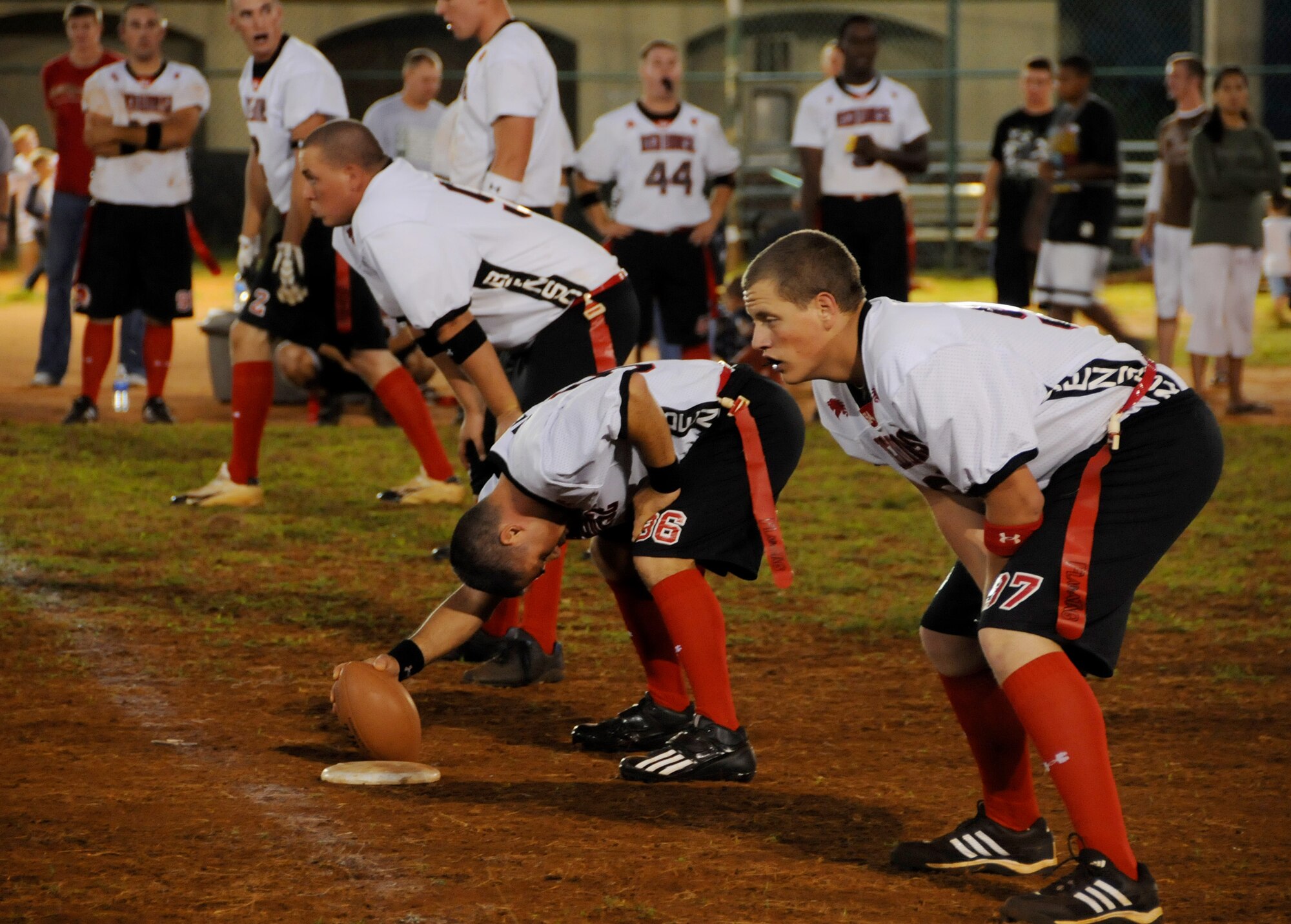 ANDERSEN AIR FORCE BASE, Guam - 554th RED HORSE Squadron Tech. Sgt. Jacob Sanabia snaps the ball during Andersen Intramural Championship game here Jan. 13. 554th RHS defeated the 734th Air Mobility Squadron, 18-7 for the title. (U.S. Air Force photo by Airman 1st Class Courtney Witt)