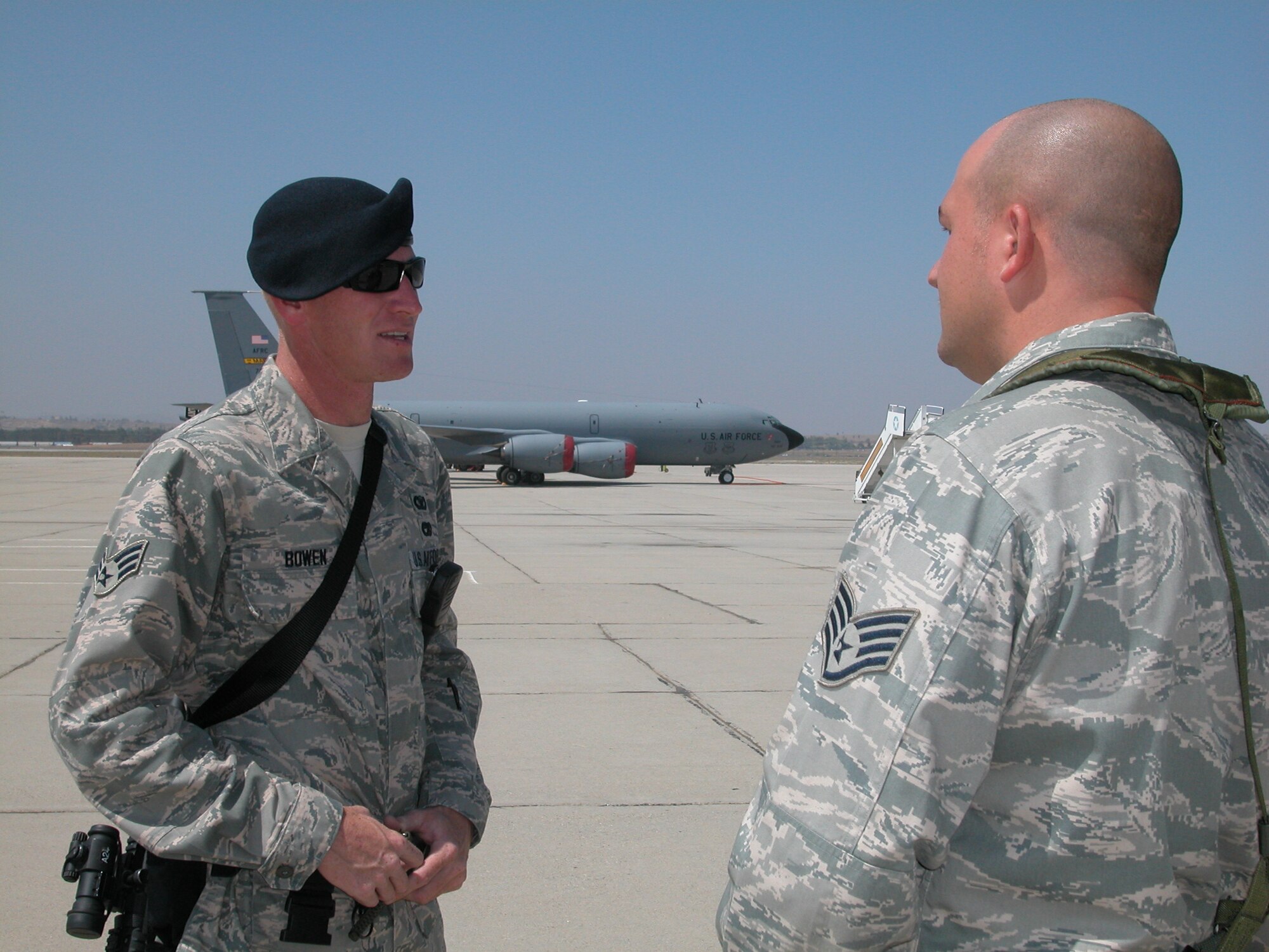 Senior Airman Randall Bowen (left) listens to feedback from Staff Sgt. Vinnie Johnson, quality control examiner, shortly after an Area Response Team exercise on the flight line. (U.S. Air Force photo by SSgt Joe Davidson)