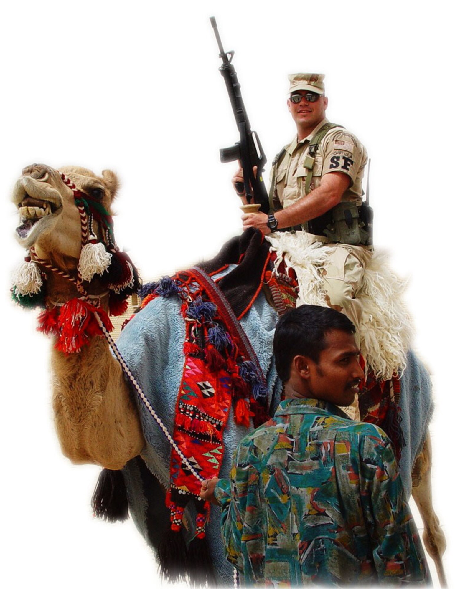 Staff Sgt. Michael Leo, 452nd SFS, finds an alternate mode of transportation while deployed to the Middle East in 2003. (U.S. Air Force photo)