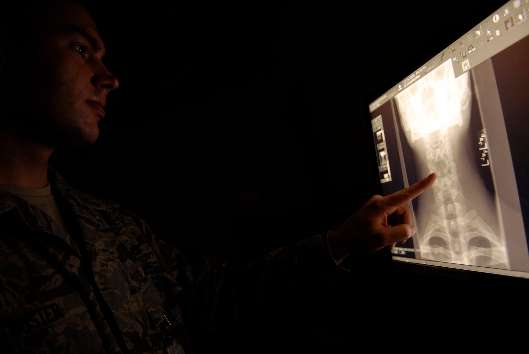 VANDENBERG AIR FORCE BASE, Calif. -- Staff Sgt. William Buster, diagnostic imaging technician with the 30th Medical Support Squadron, reviews X-ray images for quality before they are sent to a doctor on Jan. 9. (U.S. Air Force photo/Senior Airman Christian Thomas) 