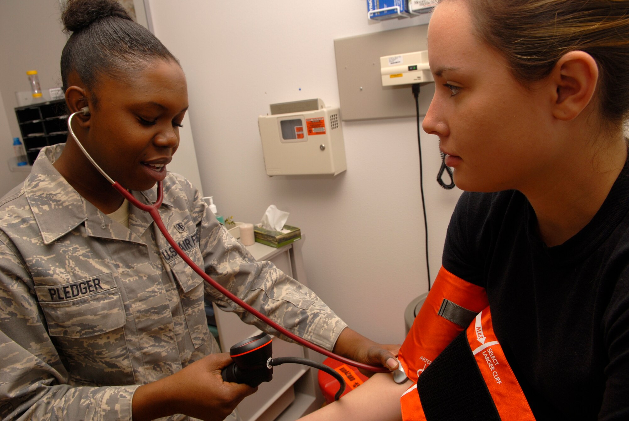 VANDENBERG AIR FORCE BASE, Calif. -- Airman 1st Class Ieshia Pledger, medical technician with the 30th Medical Operations Squadron, uses a blood pressure device to perform a check up on Airman 1st Class Laura Weghorn on Jan. 9. It is important to get annual checks to stay fit to fight. (U.S. Air Force photo/Senior Airman Christian Thomas)
  