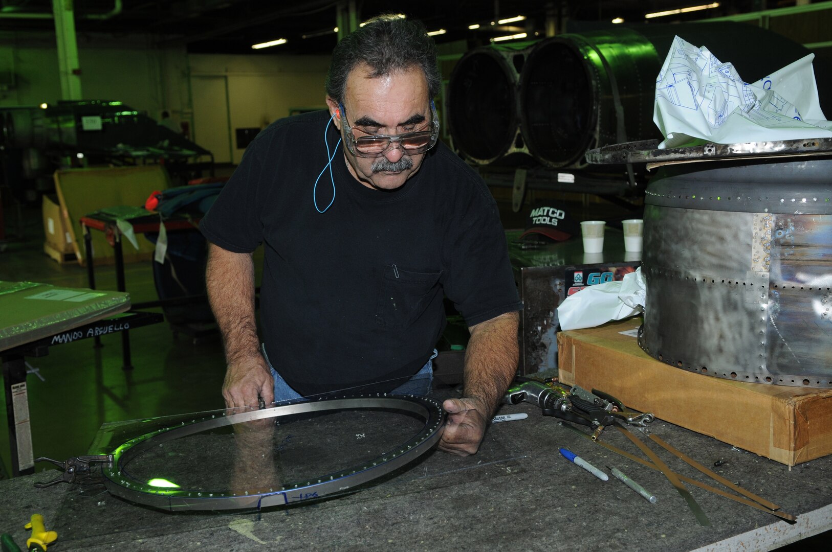 Armando Arguello, Lear Siegler Inc. contractor, prepares the u-channel ring for installation on a T-38 at the Queen Bee facility at Randolph Air Force Base, TX. Queen Bee is the only heavy maintenance provider for the T-38 fleet, providing support of T-38 inspection, maintenance and modification requirments continuously for more than 30 years. (US Air Force photo by Rich McFadden) 