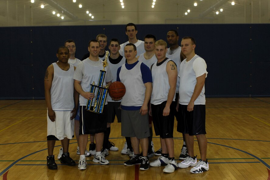 MINOT AIR FORCE BASE, N.D. -- The 91st Operations Group intramural basketball team poses for a group photo after winning the 2008-09 Intramural Basketball Championship game held at the McAdoo Fitness Center here Jan. 12.  The 91st OG took home the championship after defeating the 91st Maintenance Group 49-28. (U.S. Air Force photo by Tech. Sgt. Lee A. Osberry Jr.)