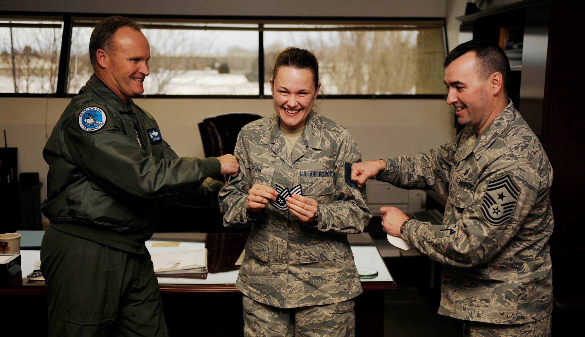 MOUNTAIN HOME AIR FORCE BASE, Idaho -- Tech. Sgt. Christy Funk, 366th Fighter Wing, receives a Stripe for Exceptional Performance, or STEP promotion, from Col. James Browne, 366th Fighter Wing commander and Chief Master Sgt. Ronald McCarthy, 366th Fighter Wing command chief Jan. 8. The STEP program, established in 1982, is designed to allow commanders to promote Airmen who meet unique or exceptional circumstances. (U.S. Air Force photo/ Senior Airman Ryan Crane)
