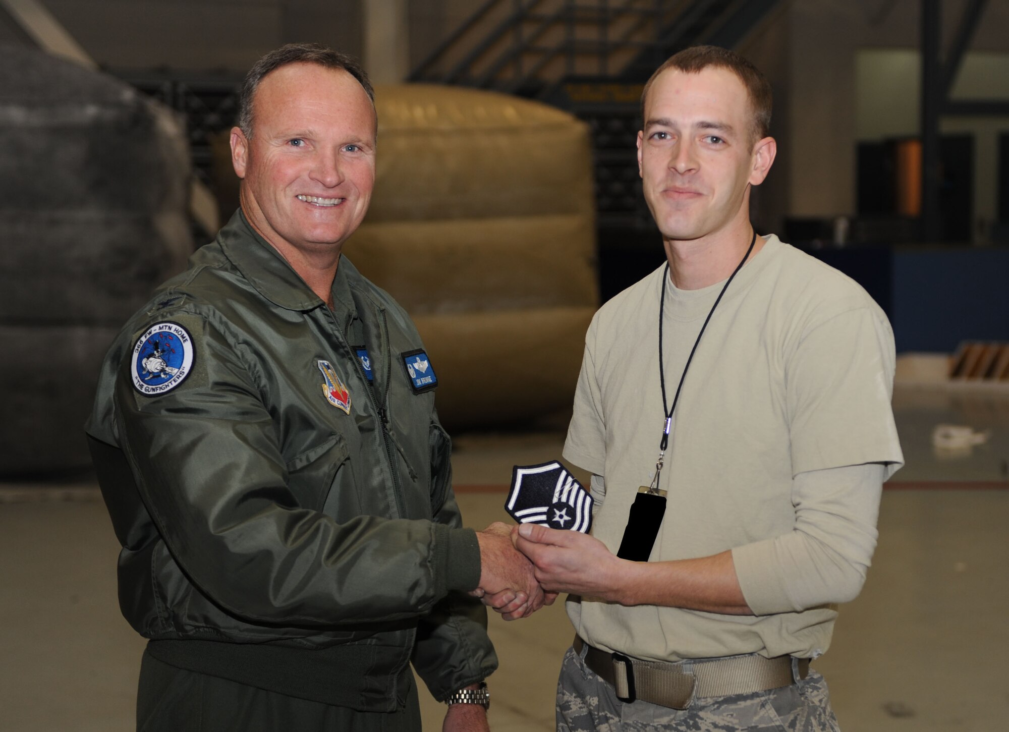 MOUNTAIN HOME AIR FORCE BASE, Idaho -- Master Sgt. William Frost, 366th Equipment Maintenance Squadron, receives a Stripe for Exceptional Performance, or STEP promotion, from Col. James Browne, 366th Fighter Wing commander Dec. 31. The STEP program, established in 1982, is designed to allow commanders to promote Airmen who meet unique or exceptional circumstances. (U.S. Air Force photo/ Senior Airman Ryan Crane)