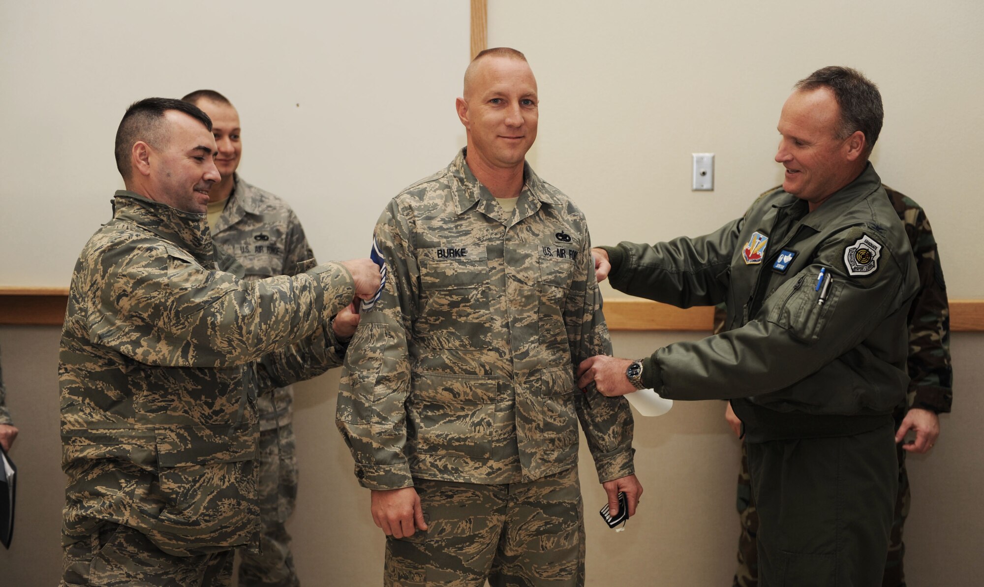 MOUNTAIN HOME AIR FORCE BASE, Idaho -- Master Sgt. Eric Burke, 366th Aircraft Maintenance Squadron, receives a Stripe for Exceptional Performance, or STEP promotion, from Col. James Browne, 366th Fighter Wing commander and Chief Master Sgt. Ronald McCarthy, 366th Fighter Wing command chief Dec. 31. The STEP program, established in 1982, is designed to allow commanders to promote Airmen who meet unique or exceptional circumstances. (U.S. Air Force photo/ Senior Airman Ryan Crane)