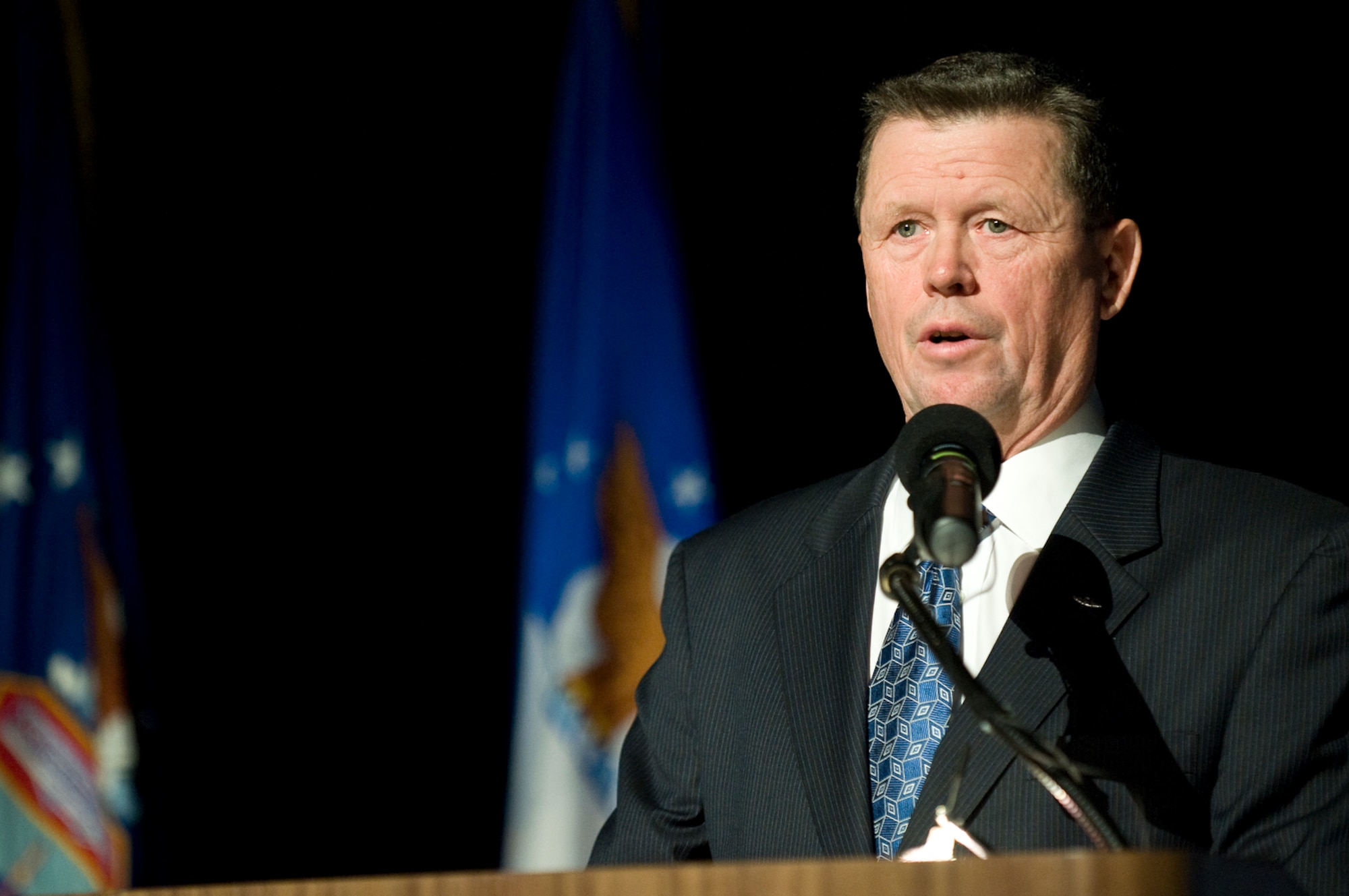 Mr. Dick Anderegg welcomes more than 200 honorees and guests for the opening of the Warrior Airmen Exhibit Jan. 12 at the National Museum of the U.S. Air Force at Wright-Patterson Air Force Base, Ohio. Mr. Anderegg is director of Air Force history and museums. (U.S. Air Force photo/Staff Sgt. Bennie J. Davis III)