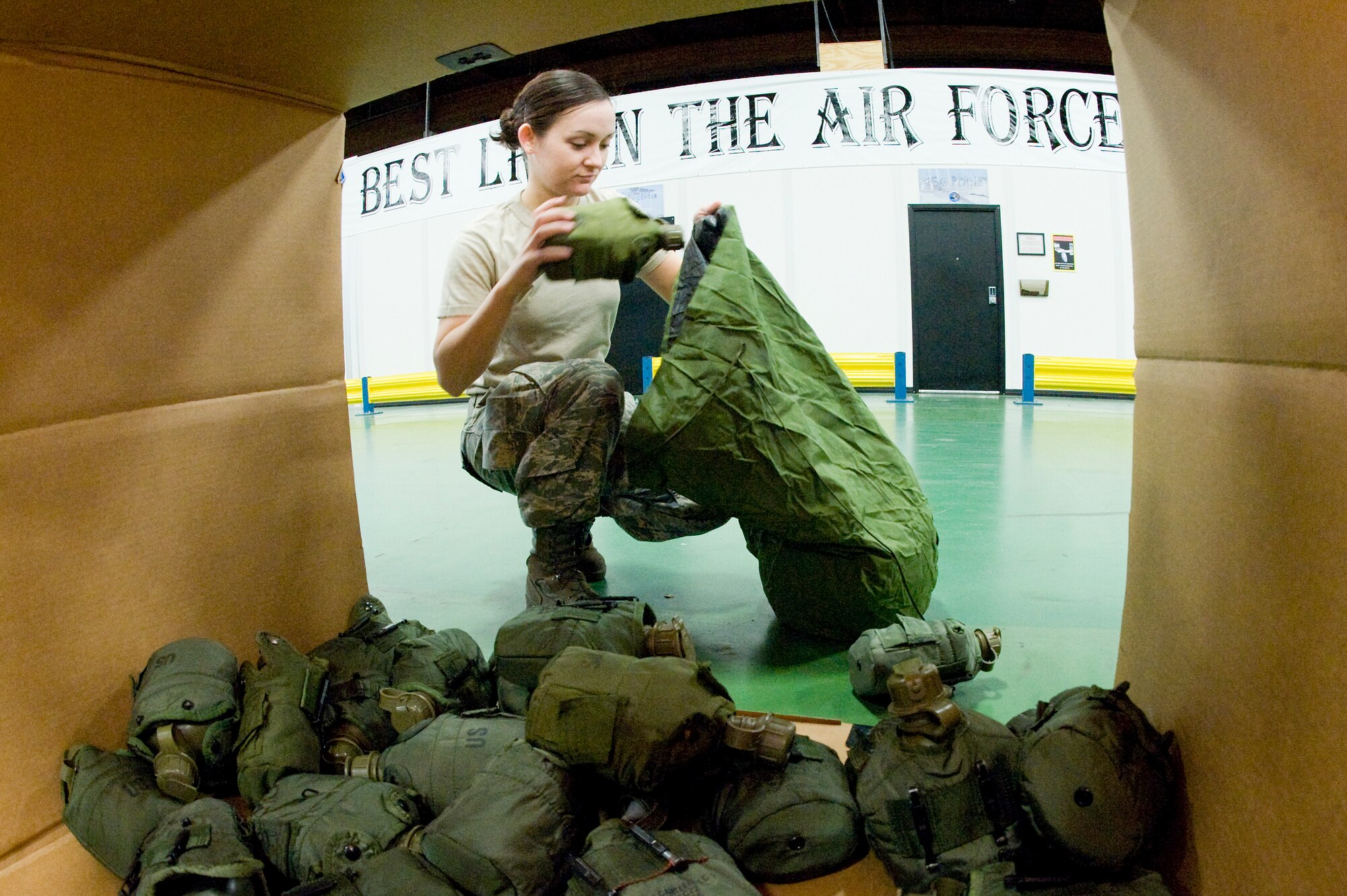 Airman 1st Class Amanda Mead, 62nd Logistics Readiness Squadron, works in the LRS mobility warehouse Jan. 13 building personnel equipment bags in preparation for the upcoming mobility exercise in February. The MOBEX and two additional exercises in May and September are designed to prepare Airmen for the Operational Readiness Inspection in October. (U.S. Air Force photo/Abner Guzman)