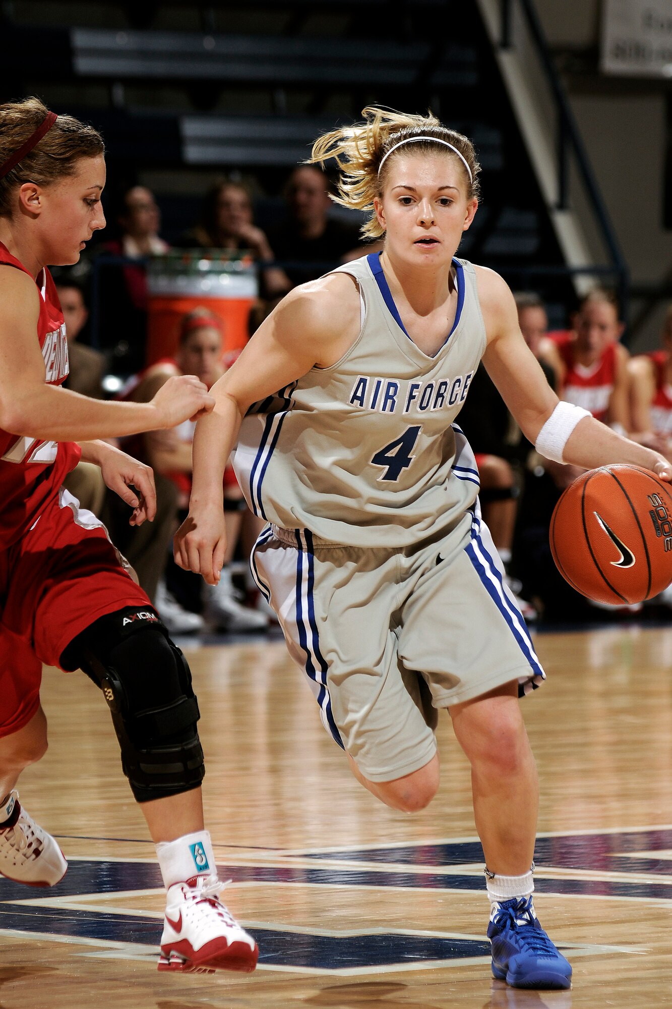 U.S. Air Force Academy freshman guard Anna Gault pushes the ball up court during the 73-39 loss against the New Mexico Lobos Jan. 9 at the Academy in Colorado. The Falcons return to action Jan. 14 at Utah. (U.S. Air Force photo/Mike Kaplan)