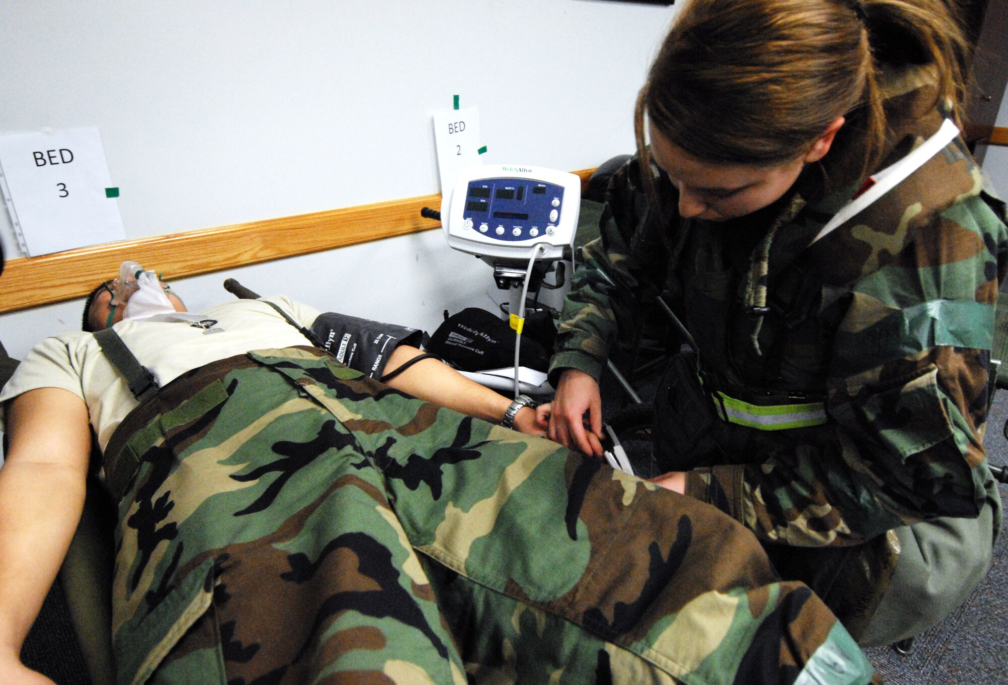 Airman 1st Class Sarah Hudak, 8th Medical Group, checks the vital signs of a patient during the Peninsula-Wide Operational Readiness Exercise at Kunsan Air Base, Republic of Korea, Jan. 14, 2009. The patient was brought in after experiencing shortness of breath. (U.S. Air Force Photo by Senior Airman Gustavo Gonzalez) 
