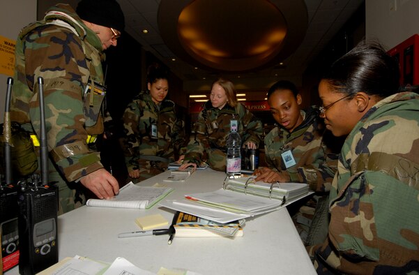 Airmen from the 8th Force Support Squadron process Airmen onto Kunsan Air Base, Republic of Korea, during the Peninsula-Wide Operational Readiness Exercise Beverly Bulldog 09-01 Jan. 12, 2009. The 8th FSS is responsible for the accountability of all U.S. forces at Kunsan AB. (U.S. Air Force Photo by Senior Airman Gustavo Gonzalez) (Released by 8th Fighter Wing Public Affairs, Staff Sgt. Trevor Tiernan)
