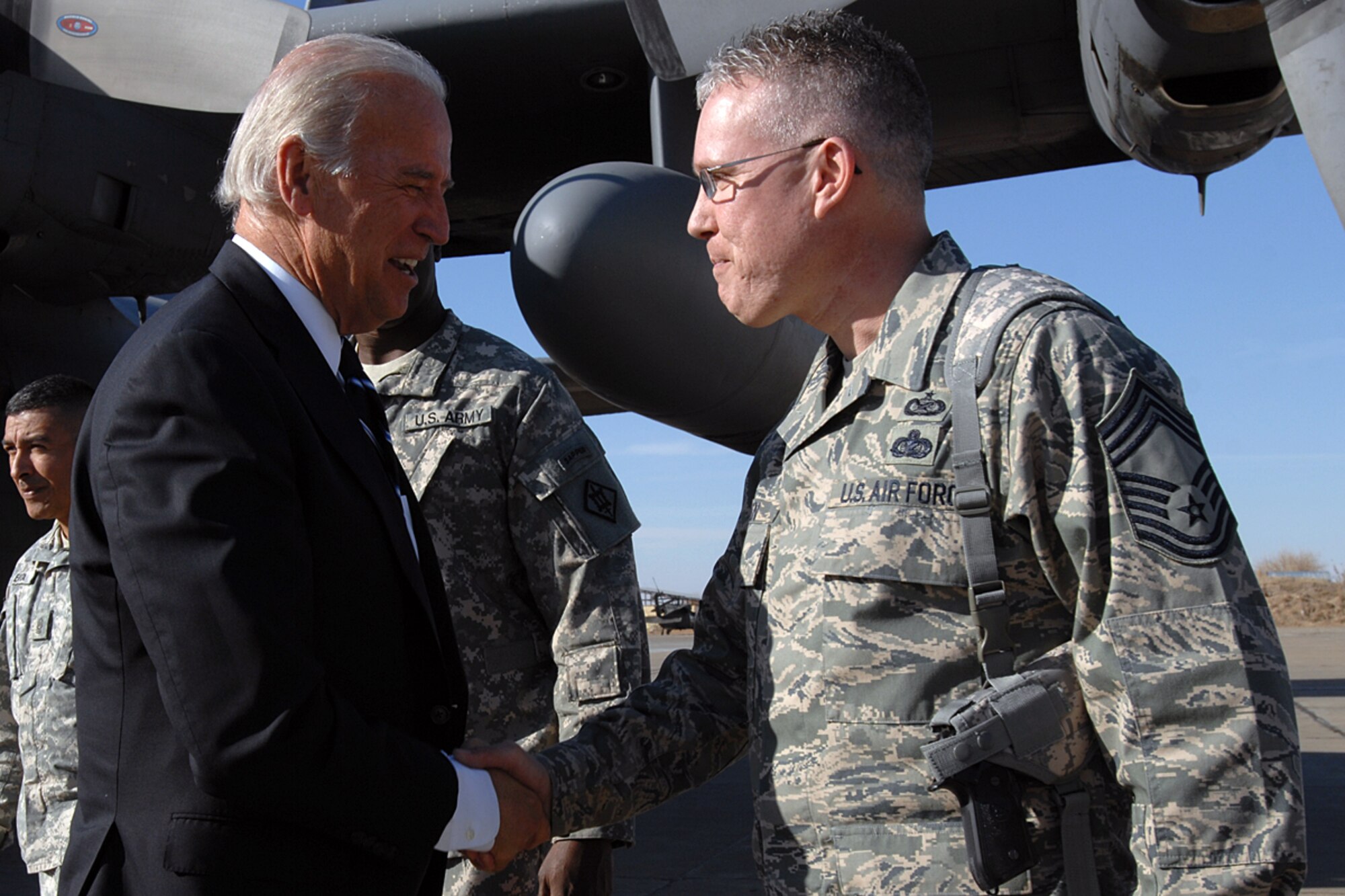 KIRKUK REGIONAL AIR BASE, Iraq – Chief Master Sgt. Bill Goben, 506th Air Expeditionary Group superintendent, greets Vice President-elect Joe Biden upon his arrival here Jan. 13.  Chief Goben, who is deployed here from the Pentagon, Wash. D.C.,was one of several military leaders present to welcome the Delaware senator and Senate Foreign Relations Committee chairman. (U.S. Air Force photo by Senior Airman Eunique Stevens)