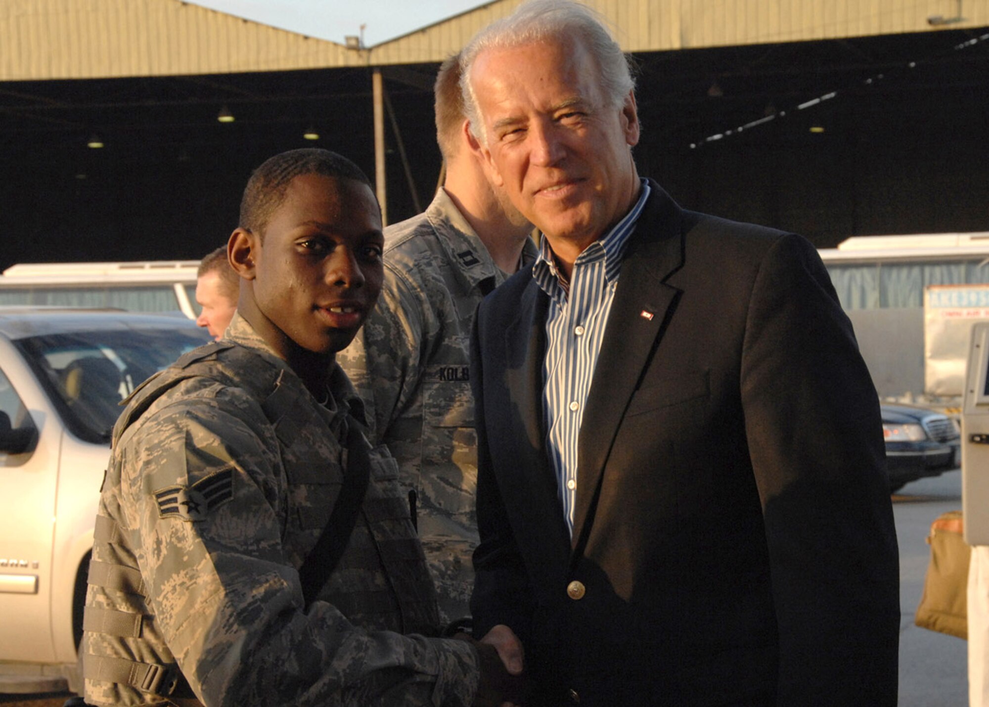 Senior Airman Walton Cornelius poses for a photo with President-elect Joe Biden Jan. 12 at an air base in Southwest Asia. Airman Cornelius is assigned to the 387th Expeditionary Security Forces Squadron. (U.S. Air Force photo/Senior Airman Courtney Richardson) 
