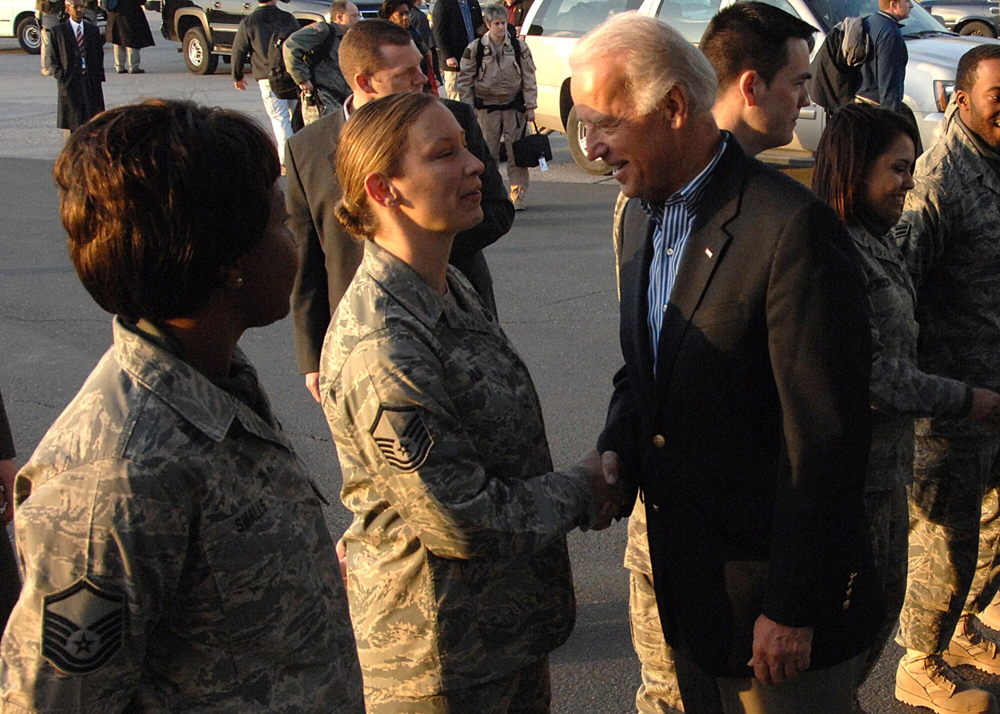 Airmen from the 387th Air Expeditionary Group meet Vice President-elect Joe Biden Jan. 12 at an air base in Southwest Asia. Vice President-elect Biden is headed into Iraq as part of his trip to the region. (U.S. Air Force photo/Senior Airman Courtney Richardson) 
