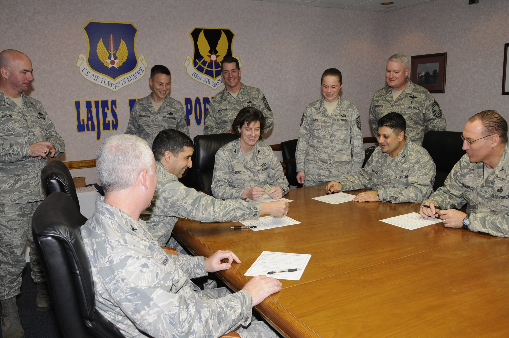 Lajes Field officers fill out applications for AFSA membership here on Jan. 8.   AFSA President Master Sgt Melissa Haase, 65th Contracting Squadron Superintendent, invited Lajes Field Colonels join to create awareness that officers can join AFSA.  (Photo by Tech Sgt. Rebecca Corey)