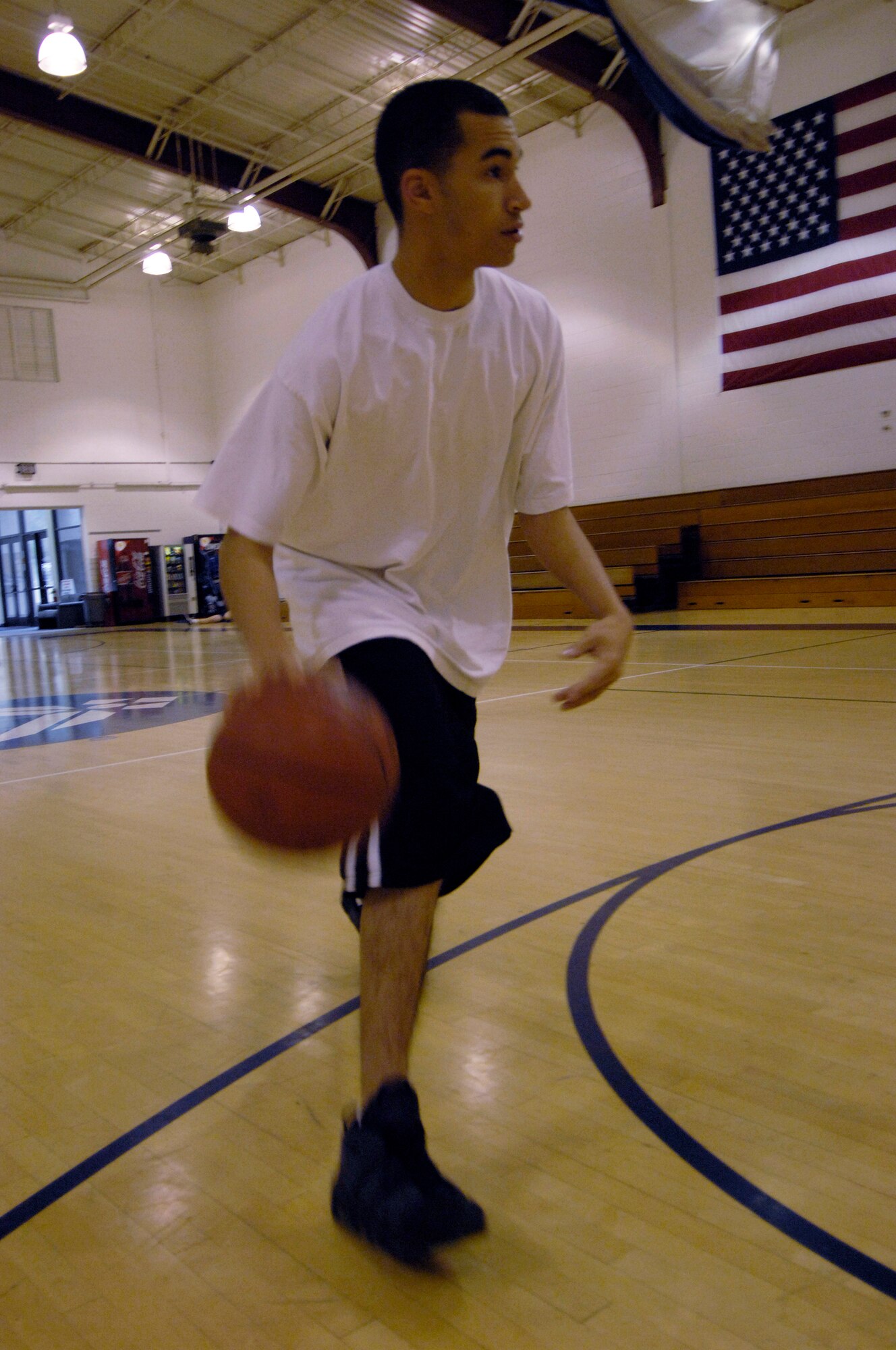 VANDENBERG AIR FORCE BASE, Calif. --  Dribble the ball with your dominant hand, and approach the basket slowly, dribbling the ball. (U.S. Air Force photo/Senior Airman Matthew Plew)