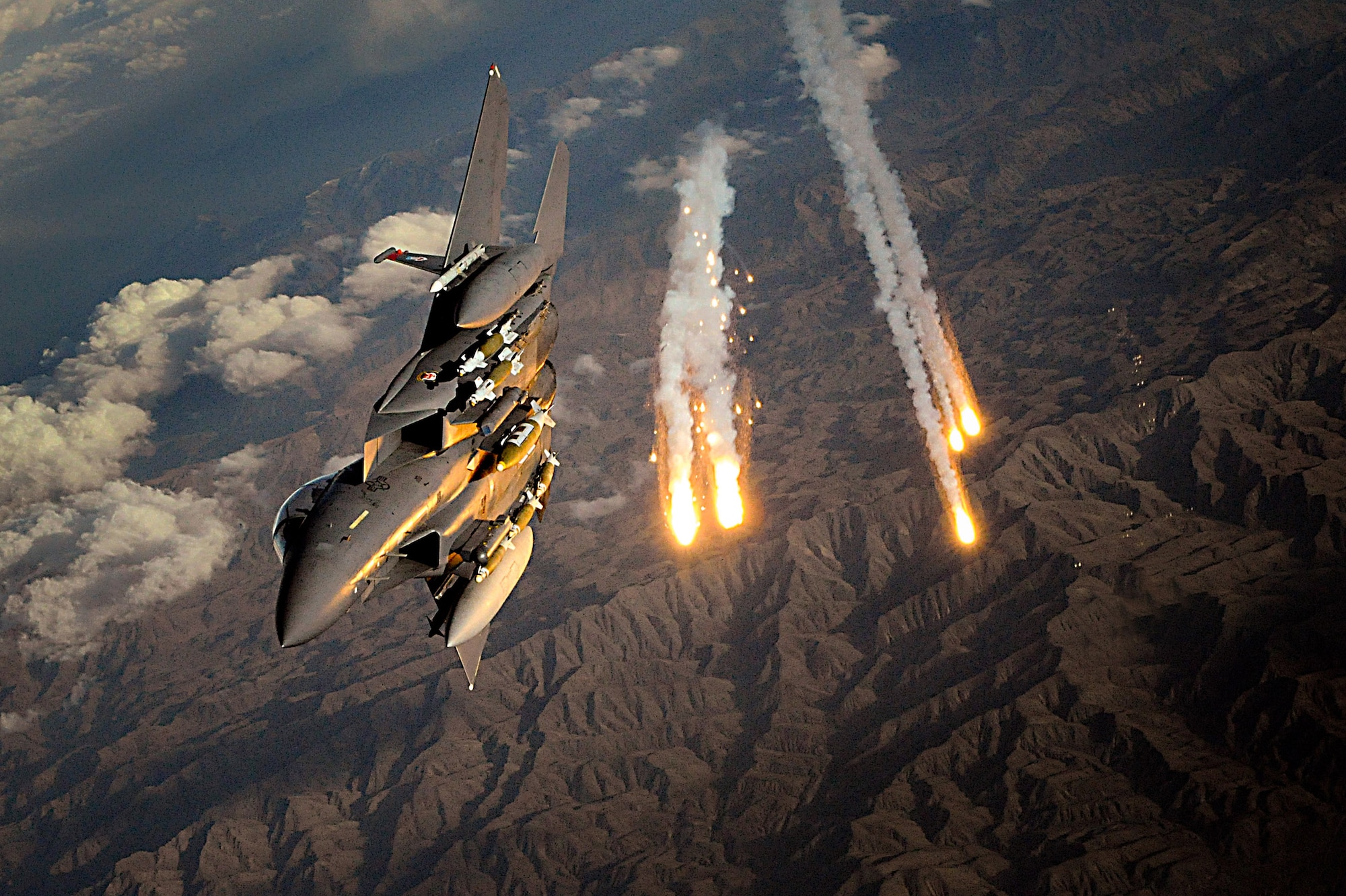 An F-15E Strike Eagle deploys countermeasure flares over Afghanistan. An array of avionics and electronics systems gives the F-15E the capability to fight at low altitude, day or night, and in all weather. (U.S. Air Force photo/Staff Sgt. Aaron Allmon)  