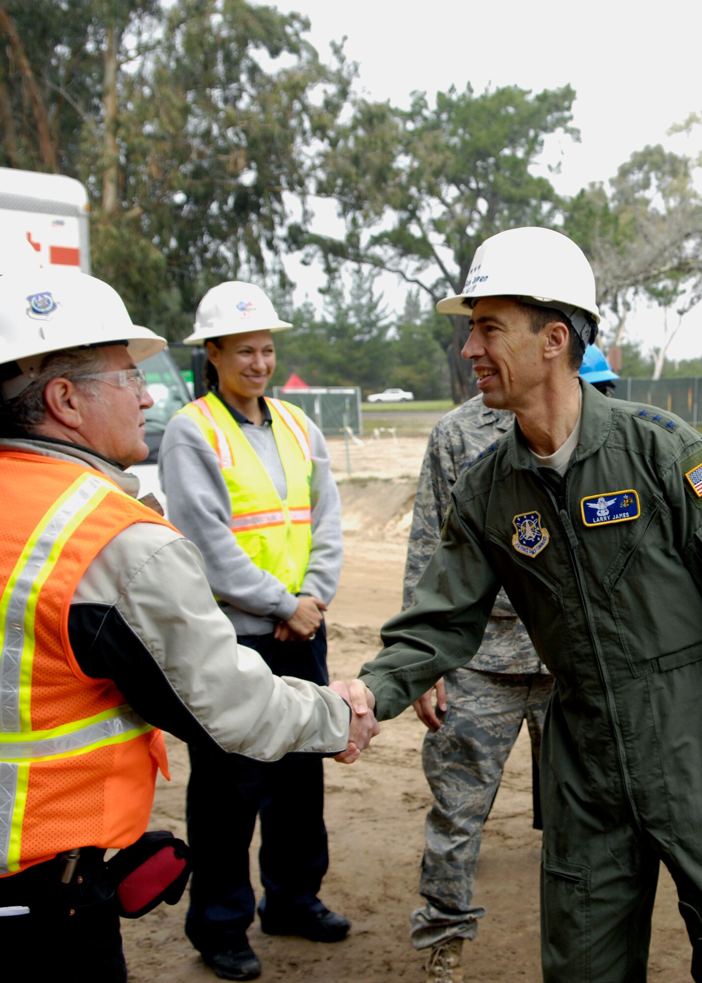 VANDENBERG AIR FORCE BASE, Calif.-  Lt. Gen. Larry James is greeted by Wayne Sanford of MACTEC Construction at the site of the new fitness center.  The fitness center was one of the many stops during General James' official base tour Jan. 8. (U.S. Air Force photo/ Airman 1st Class Heather R. Shaw)