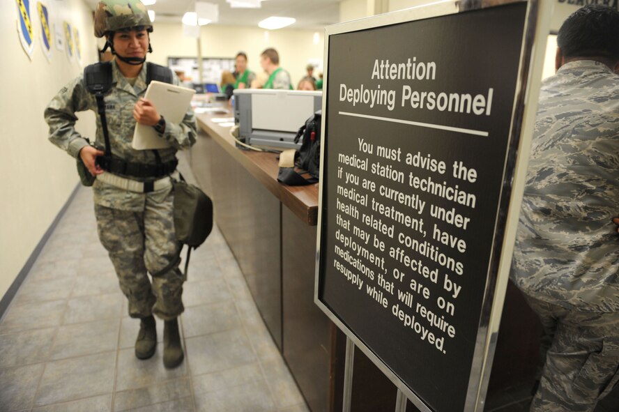 DYESS AIR FORCE BASE, Texas -- Senior Airman Jacklyn Sugiyama, from the 7th Operation Support Squadron, processes through the personnel deployment function (PDF) line during the operational readiness inspection here, Jan. 6. It is through the PDF line that Airman Sugiyama has her records reviewed by representatives of the various agencies around base. (U.S. Air Force photo by Senior Airman Domonique Simmons)
