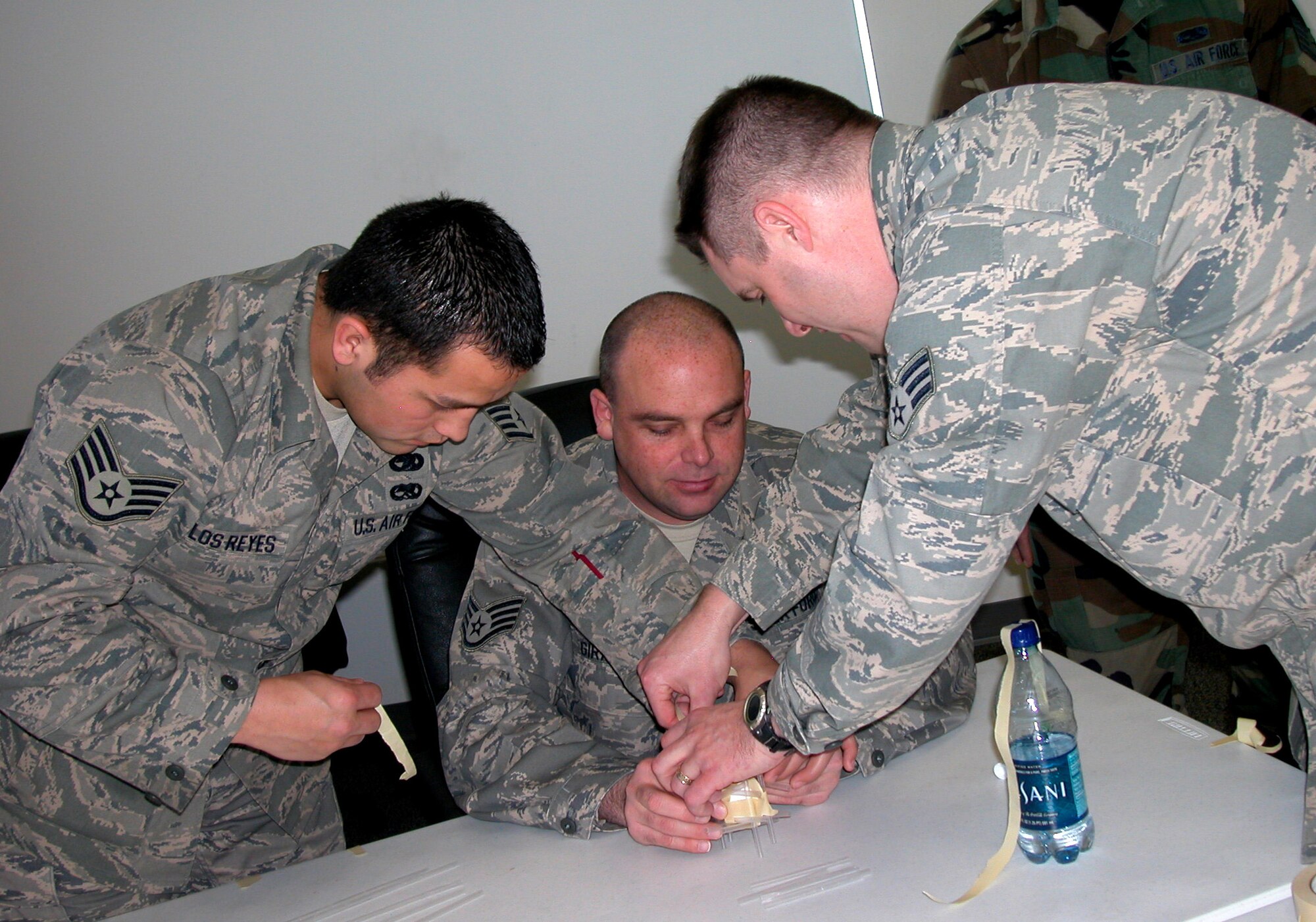 Staff Sgt. Cody De Los Reyes, Staff Sgt. James Girardo, and Senior Airman Scott Gatewood use straws and tape to construct an apparatus that will allow an egg to survive a 12-foot drop. The exercise in teamwork was part of the Air Force Reserve Command NCO Leadership Development Course, which the 419th Fighter Wing offers three times a year. The course offers college credit and hands-on experience in leadership and management, and addresses theories and concepts of leadership and management. Wing policy requires members to attend LDC or complete Course 9 to be promoted to technical sergeant. “We were the first wing to make it mandatory,” said Master Sgt. Marites Ramoneda-Thomas, Assistant Chief of Education and Training. “Because of this, we graduate the most members most of the time compared to other wings.” The 419 FW received Outstanding Training Office awards for its support of LDC programs in 2005 and 2007. (U.S. Air Force photo)