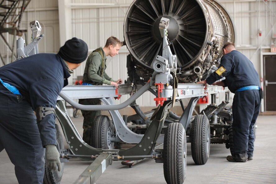 DYESS AIR FORCE BASE, Texas-- 7th Bomb Wing maintainers hoist an engine dolly in place to mobilize the aircraft engine for installation during the operational readiness inspection (ORI) here, Jan. 6. Maintainer?s capability to successfully repair and perform routine maintenance is tested during the ORI. (U.S. Air Force photo by Senior Airman Domonique Simmons)