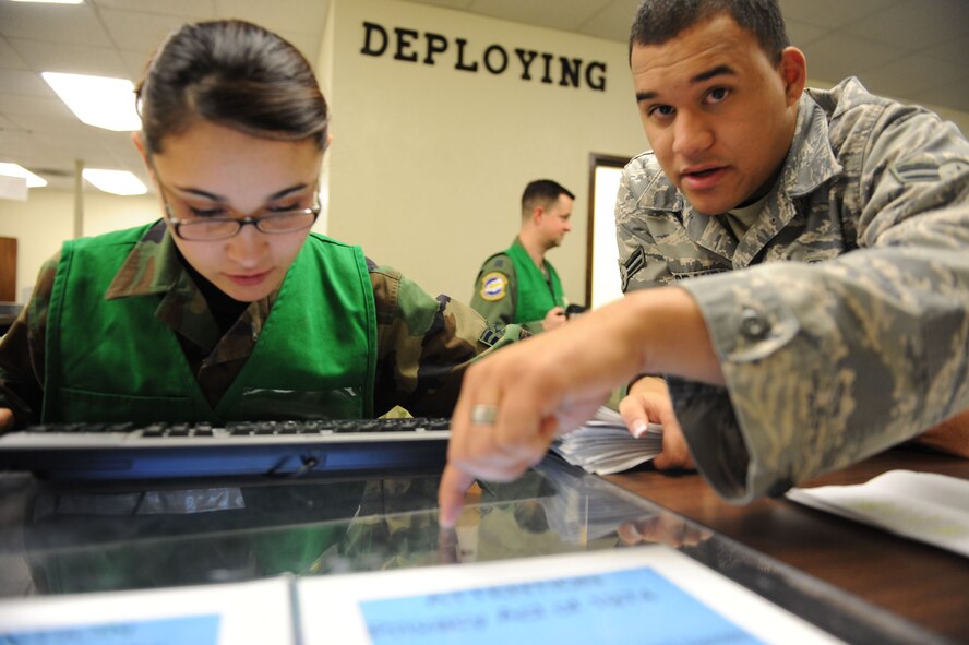 DYESS AIR FORCE BASE, Texas -- Airman 1st Class Luke Orander, from the 7th Aeromedical Dental Squadron, assist fellow Airman working on the personnel deployment function (PDF) line during the operational readiness inspection here, Jan.6. Personnel working on the PDF line are responsible for ensuring that all deployers have completed all out-processing requirements prior to their departure.  (U.S. Air Force photo by Senior Airman Domonique Simmons)