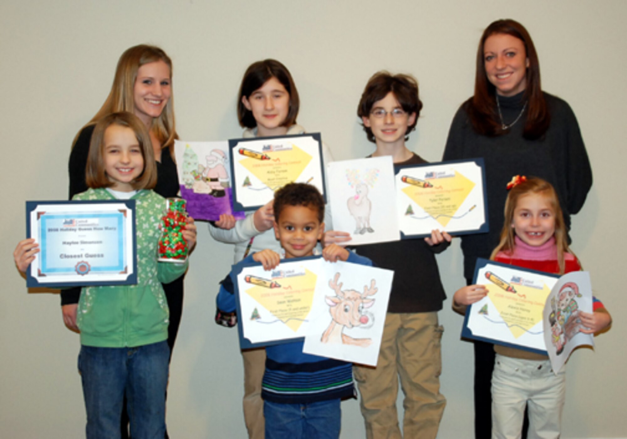 The United Communities staff recently announced the award winners for their holiday candy counting and coloring contests. Each winner received a personalized certificate for their accomplishment along with a prize. Pictured back row (left to right), Amber Stadler, UC Fun Committee coordinator; Abby Ferson, 11, who won most creative in the coloring contest; Tyler Ferson, 12, who won first place in the coloring contest 10 years and up category; and Krista Logan, UC Fun Committee coordinator. Front row (left to right), Haylee Simonsen, 9, who guessed closest to the amount of candy; Sean Watson, 5, who won first place in the coloring contest under 5 years category; and Alexis Hovay, 6, who won first place in the coloring contest 6-to-8 years category. UC hosts contests and craft nights for each holiday. Upcoming holiday events will be held for Valentine’s Day, Easter and Mother’s Day. Other events include UC’s first Bingo Night scheduled for Jan. 28. For more information, call the UC Leasing Office at (609) 723-4290. (U.S. Air Force photo/Airman 1st Class Bekah Phy)    