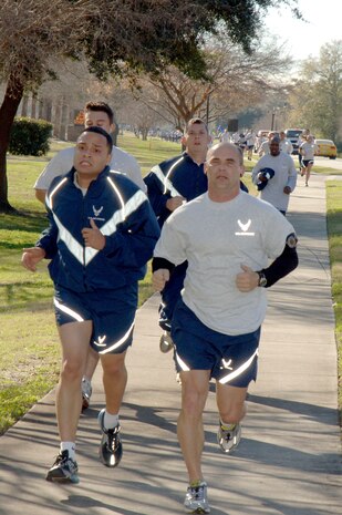 Airmen from Charleston AFB step up their pace as they get closer to the finish line during the Commander's Fitness Challenge on base Jan. 9. More than 400 Airmen from various squadrons came out to participate in the  5K run. (U.S. Air Force photo/Staff Sgt. Marie Cassetty)