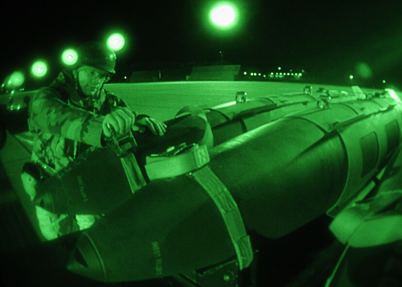 DYESS AIR FORCE BASE, Texas -- Senior Airman Chris Chambers, a Weapons Inspector from the 7th Munitions Squadron, operates the ratchet  tightening system, making sure the webbing  secures the bombs for the operational readiness inspection here, Jan 6. The weapons inspectors play a vital role in ensuring operational readiness. (U.S. Air Force photo by Airman 1st Class Stephen Reyes)