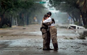 Pararescueman Staff Sgt. Lopaka Mounts receives a hug from a Texas resident Sept. 13 during search and rescue operations after Hurricane Ike. Sergeant Mounts is assigned to the 331st Air Expeditionary Group at Randolph Air Force Base, Texas. (U.S. Air Force photo/Staff Sgt. James L. Harper Jr.)