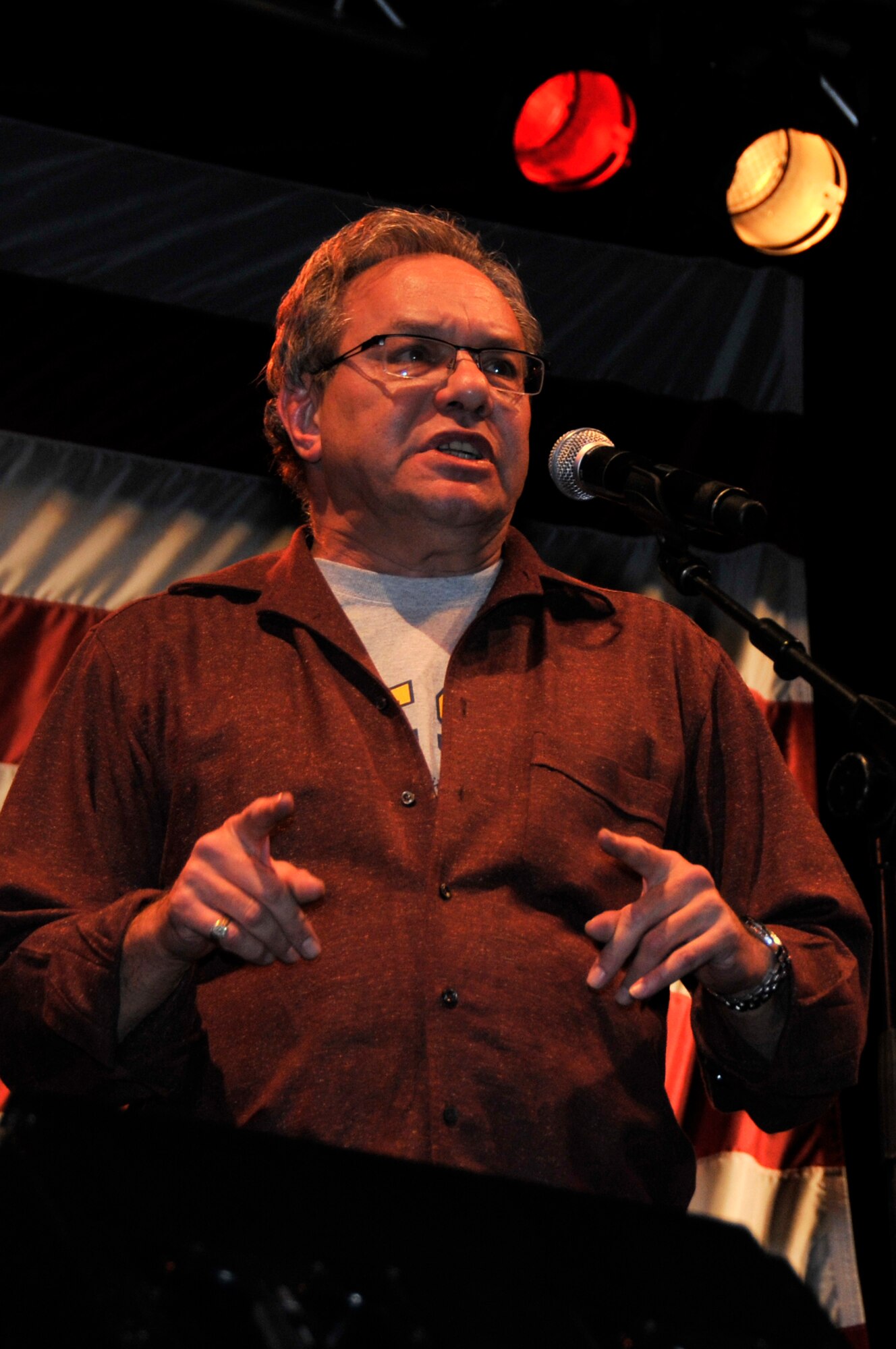 Lewis Black brings laughs to RAF Lakenheath and RAF Mildenhall Airmen and their families during the United Service Organization's Holiday Tour Dec. 20 at RAF Lakenheath, England. The USO holiday tour went to five different countries and included performances by Kathleen Madigan, Kellie Pickler, and Tichina Arnold. (U.S. Air Force photo by Airman 1st Class Perry Aston)
