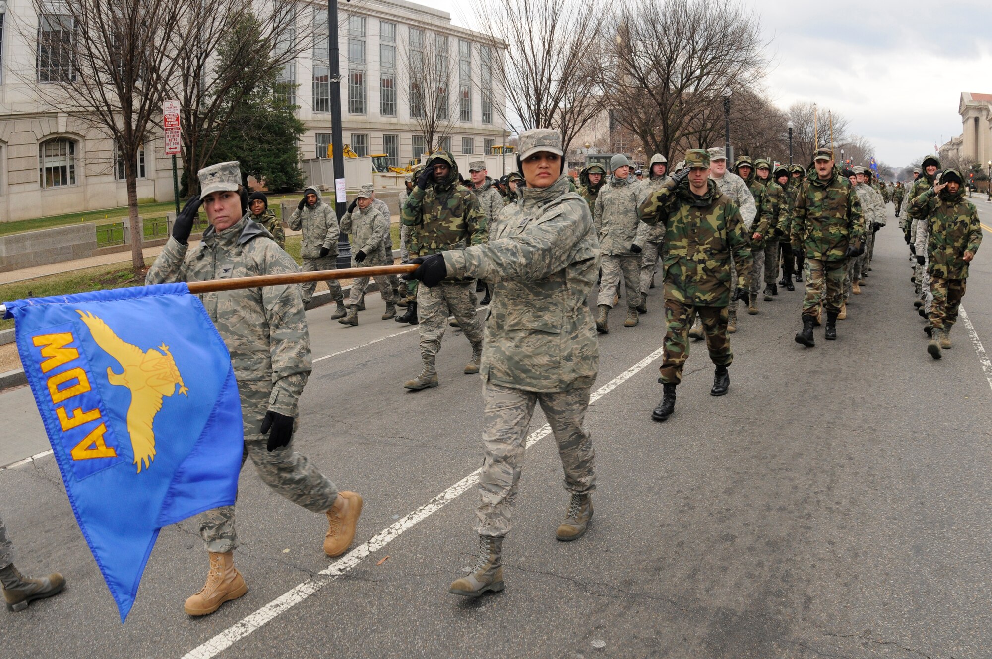 Col. Elisabeth B. Borelli, 11th Operations Group commander, and Chief Master Sgt. Robin Johnson, 11th Wing command chief, lead a flight of Airmen from the Air Force District of Washington down Constitution Avenue  Jan. 11 in Washington during a practice run of the inauguration parade for President-elect Barack Obama. (U.S. Air Force photo by Staff Sgt. Dan DeCook)
